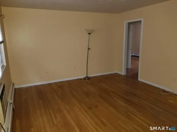a view of a livingroom with wooden floor