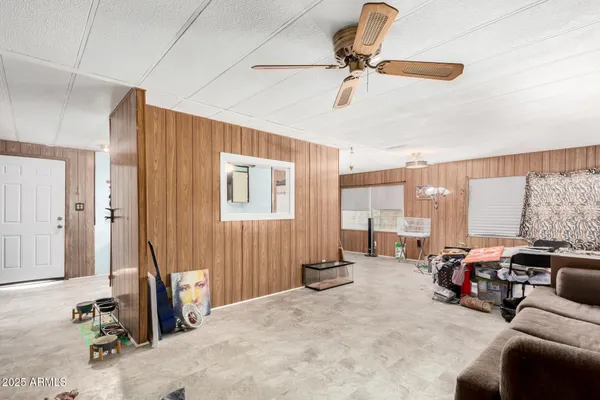 a view of a livingroom with furniture and a window
