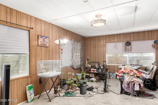 a living room with lots of furniture and a chandelier