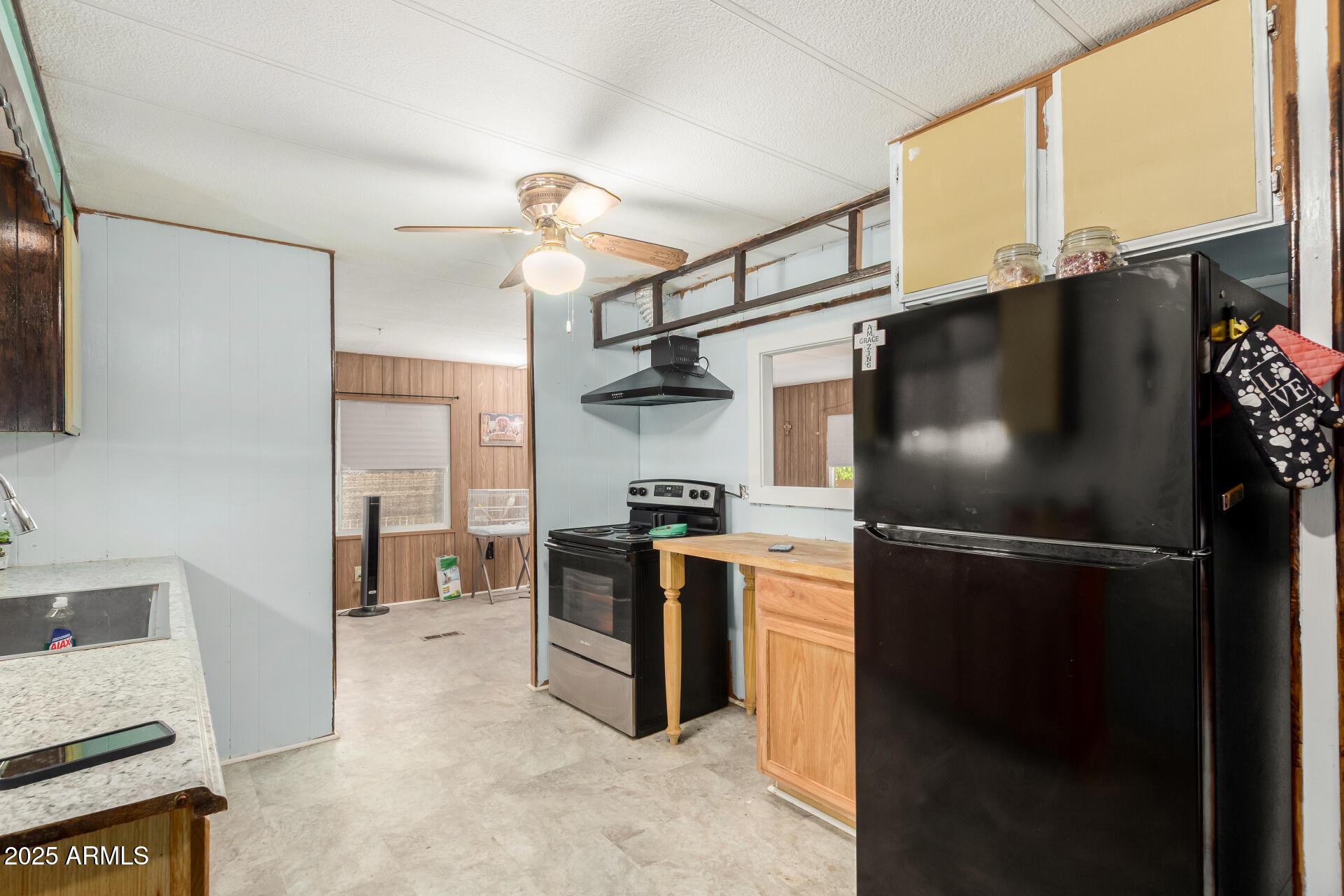 11252 East Boise Street Apache Junction, AZ 85120 - Photo 15 of 34 a kitchen with stainless steel appliances granite countertop a refrigerator and a stove top oven