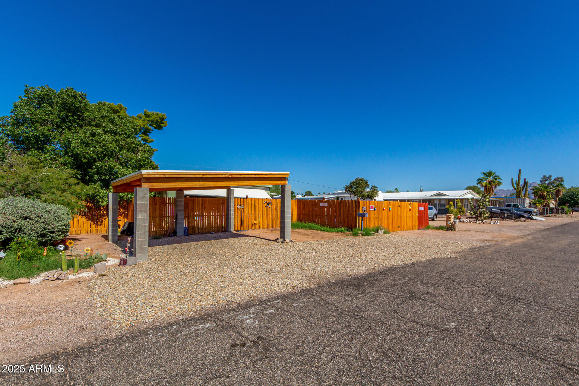 11252 East Boise Street Apache Junction, AZ 85120 - Photo 2 of 34 a view of a house with a outdoor space and sitting area