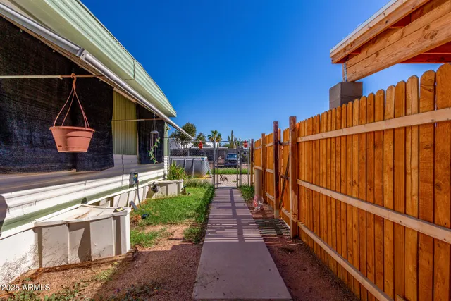 a view of a backyard with sitting area