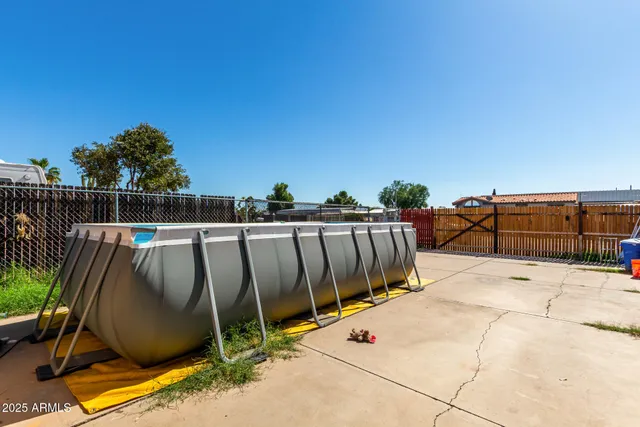 a view of outdoor space with swimming pool