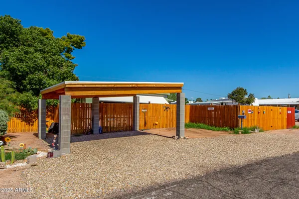 a view of a house with backyard and porch