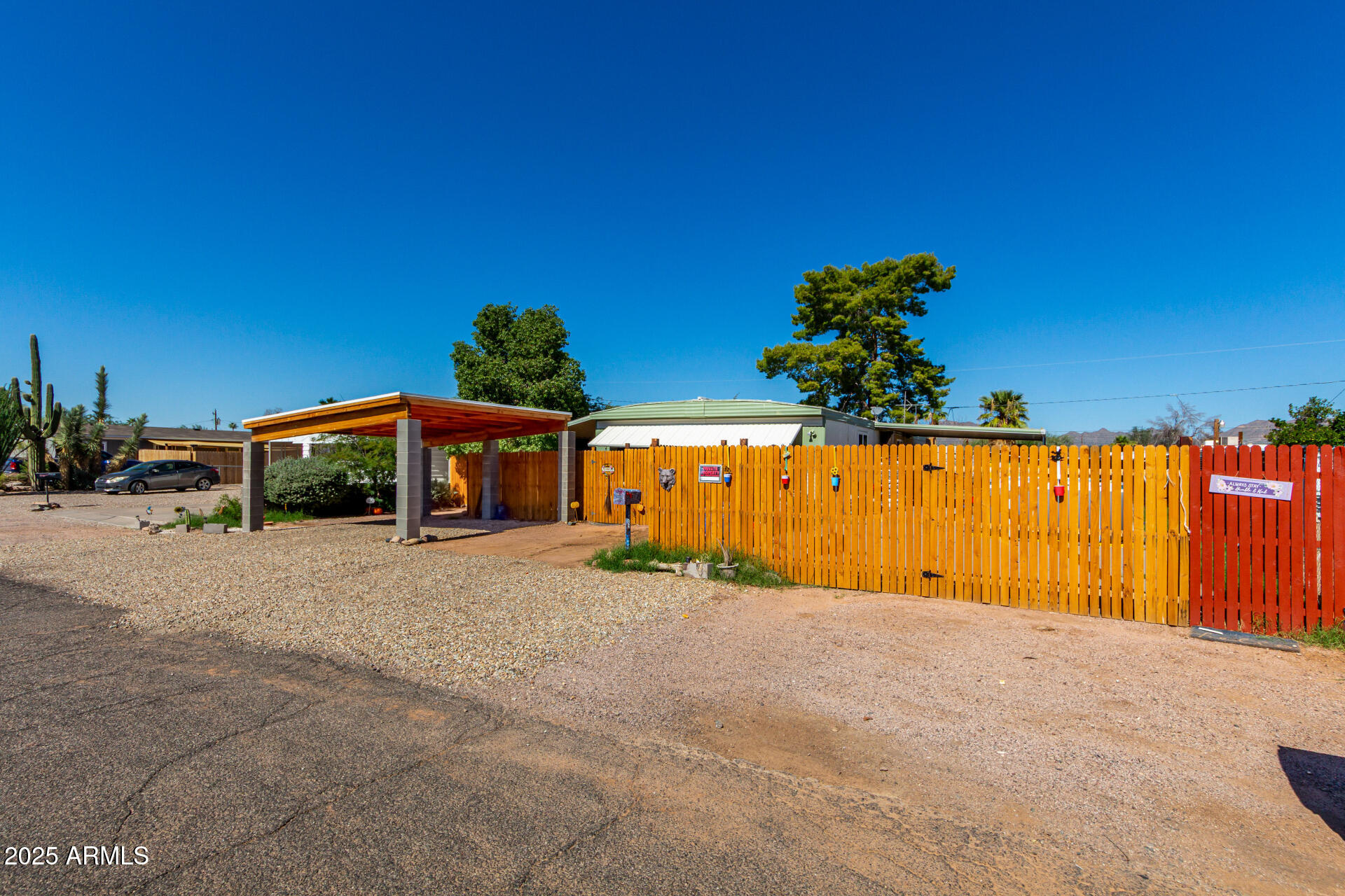 11252 East Boise Street Apache Junction, AZ 85120 - Photo 4 of 34 a front view of a house with a yard