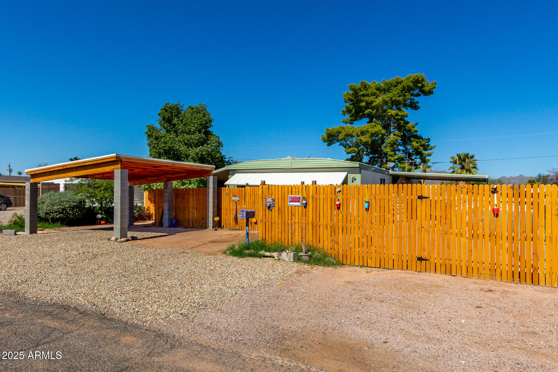 11252 East Boise Street Apache Junction, AZ 85120 - Photo 5 of 34 a front view of a house with a yard