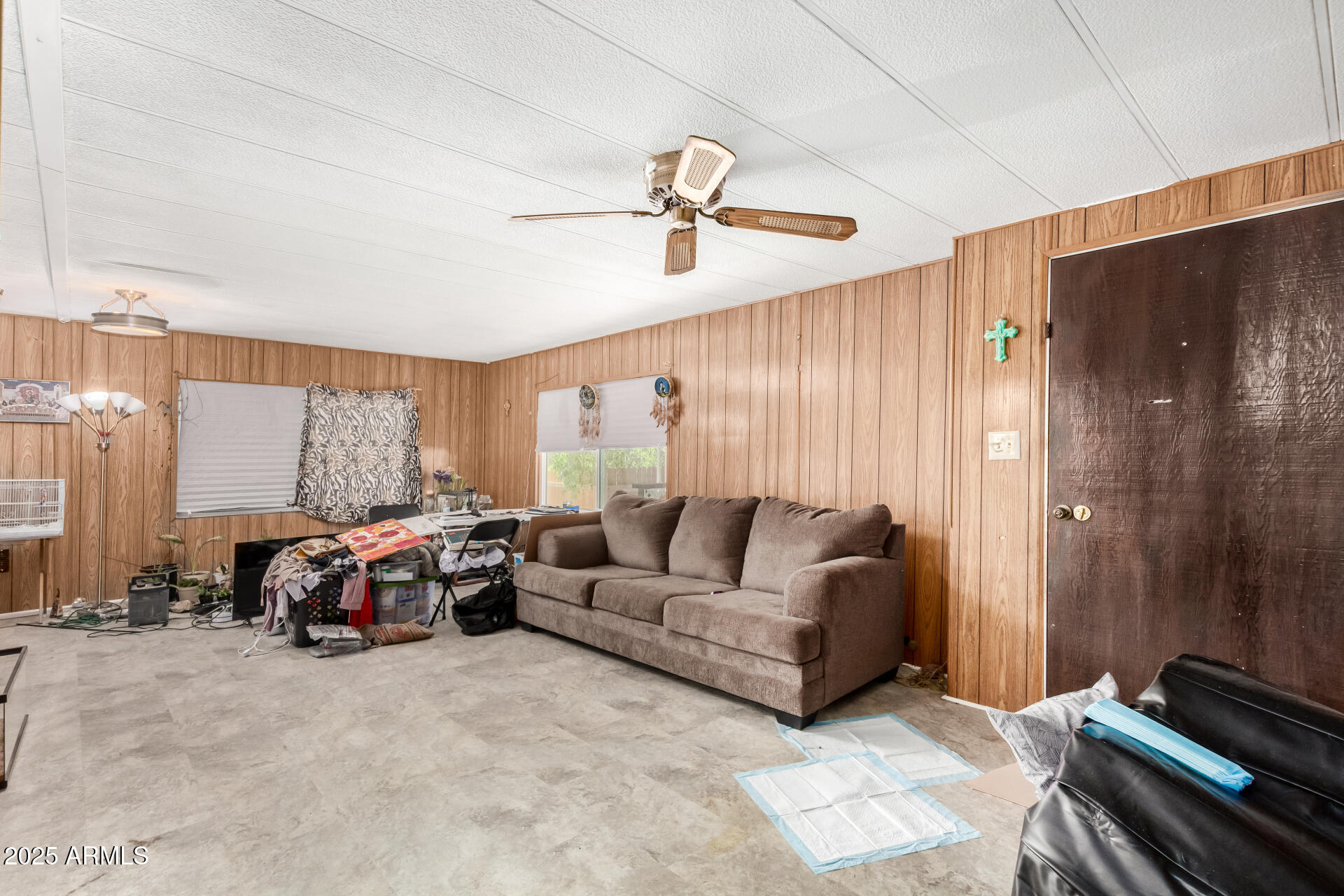 11252 East Boise Street Apache Junction, AZ 85120 - Photo 9 of 34 a living room with furniture ceiling fan and a window
