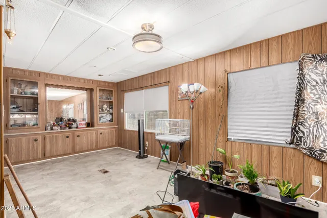 a room with fireplace furniture and a large window