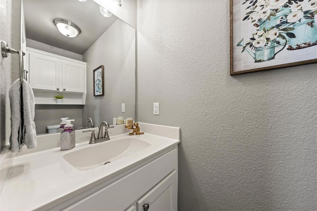 828 Agile Street Hewitt, TX 76643 - Photo 20 of 30 a bathroom with a sink and a mirror