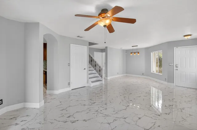 a kitchen with stainless steel appliances granite countertop a stove a refrigerator and a sink