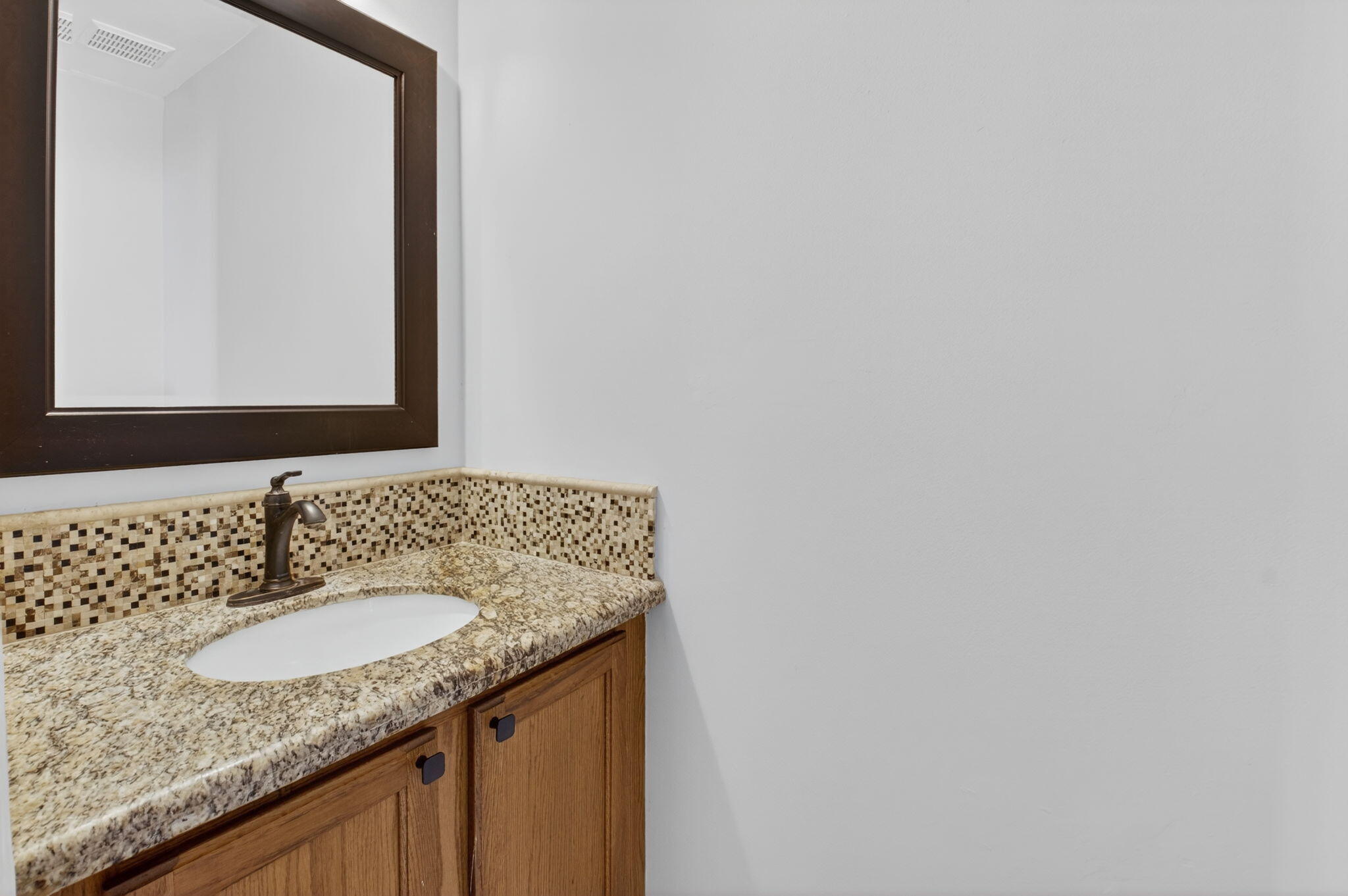 1728 Arezzo Circle Boynton Beach, FL 33436 - Photo 21 of 66 a bathroom with a granite countertop sink and a mirror