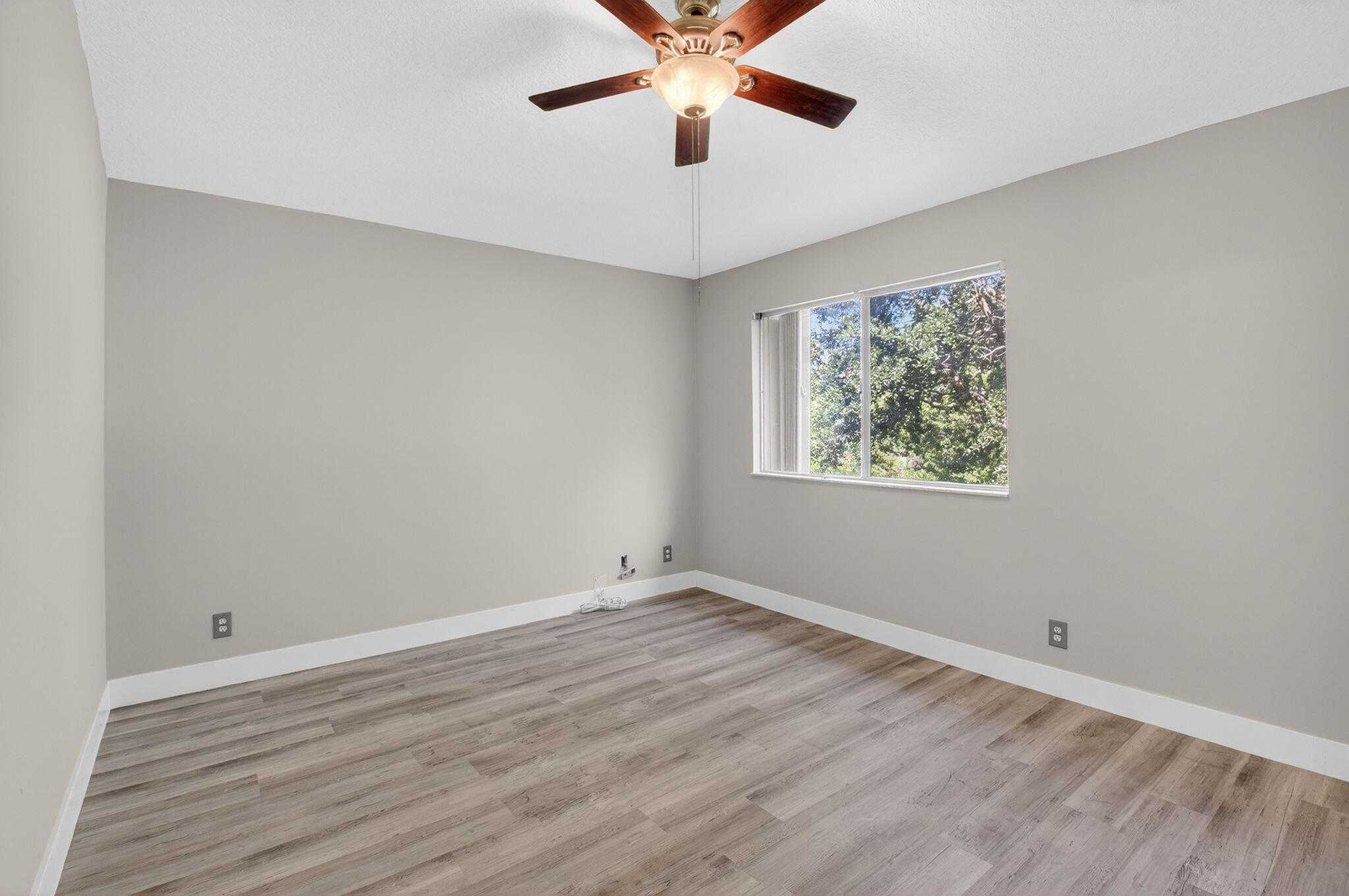 1728 Arezzo Circle Boynton Beach, FL 33436 - Photo 27 of 66 wooden floor in an empty room with a window