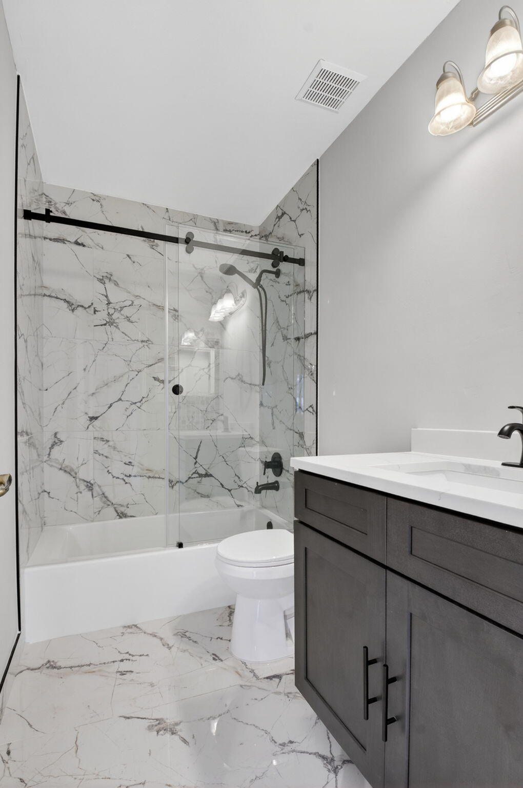 1728 Arezzo Circle Boynton Beach, FL 33436 - Photo 34 of 66 a bathroom with a sink toilet and shower