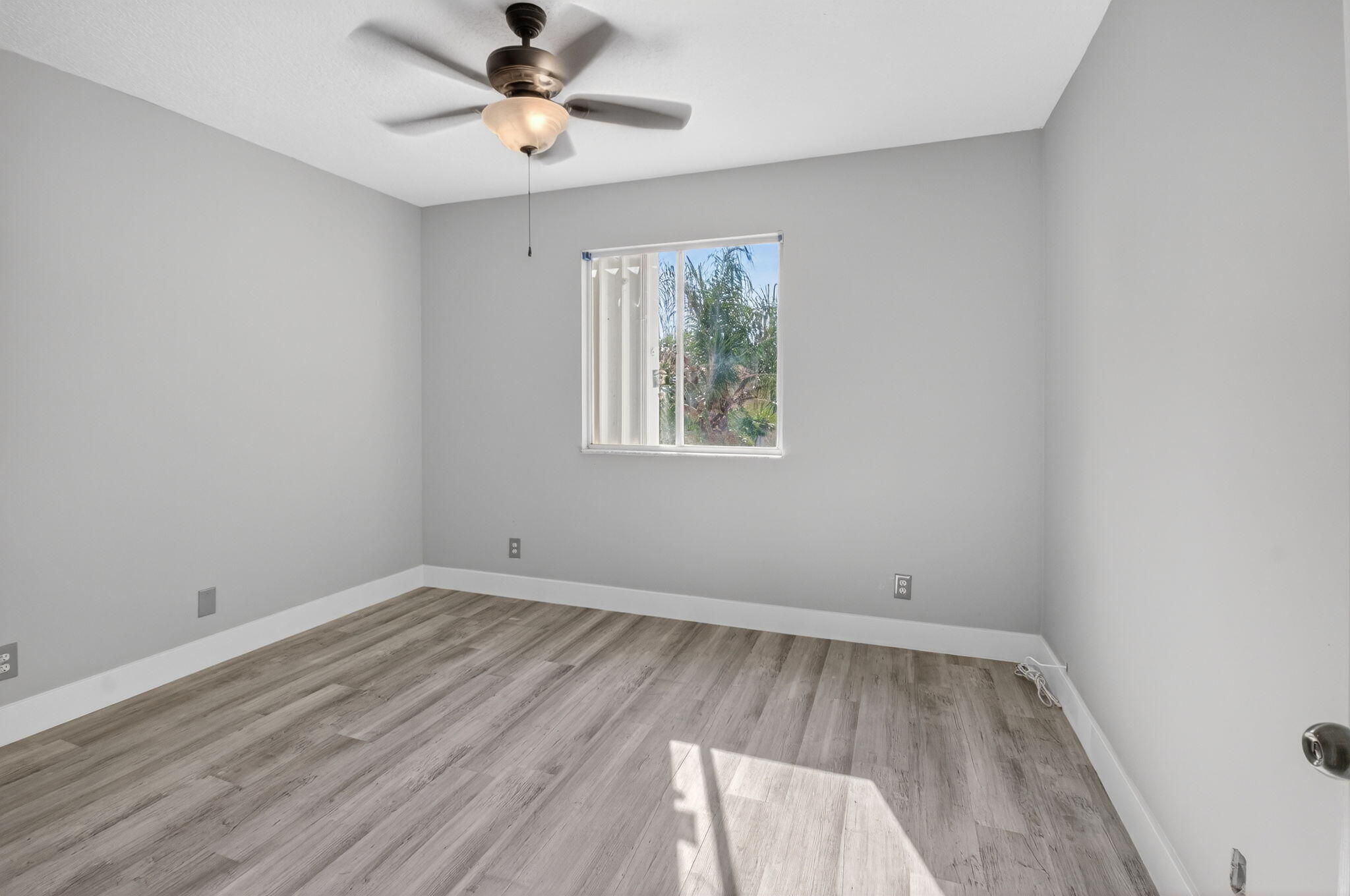 1728 Arezzo Circle Boynton Beach, FL 33436 - Photo 37 of 66 wooden floor in an empty room with a window