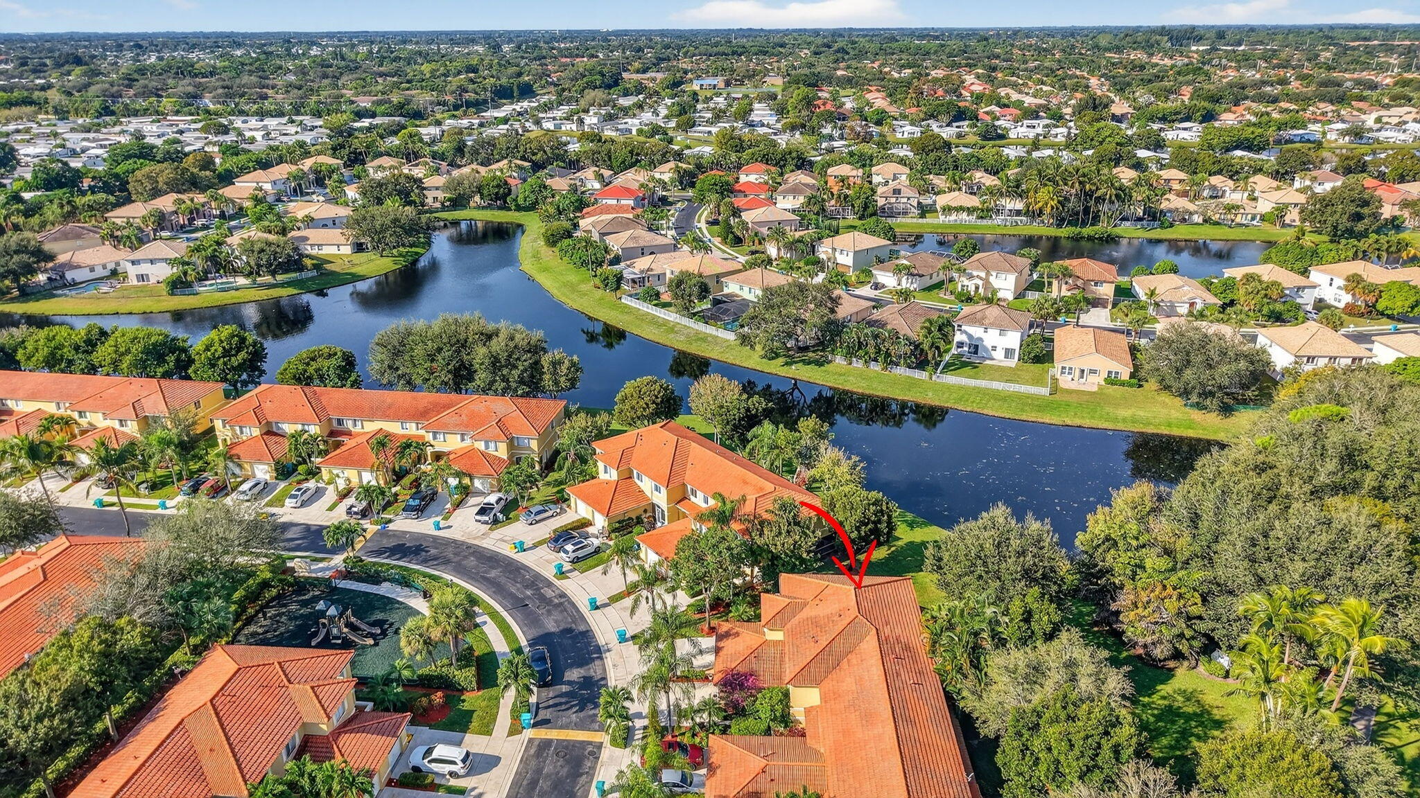 1728 Arezzo Circle Boynton Beach, FL 33436 - Photo 42 of 66 an aerial view of residential houses with outdoor space and trees all around