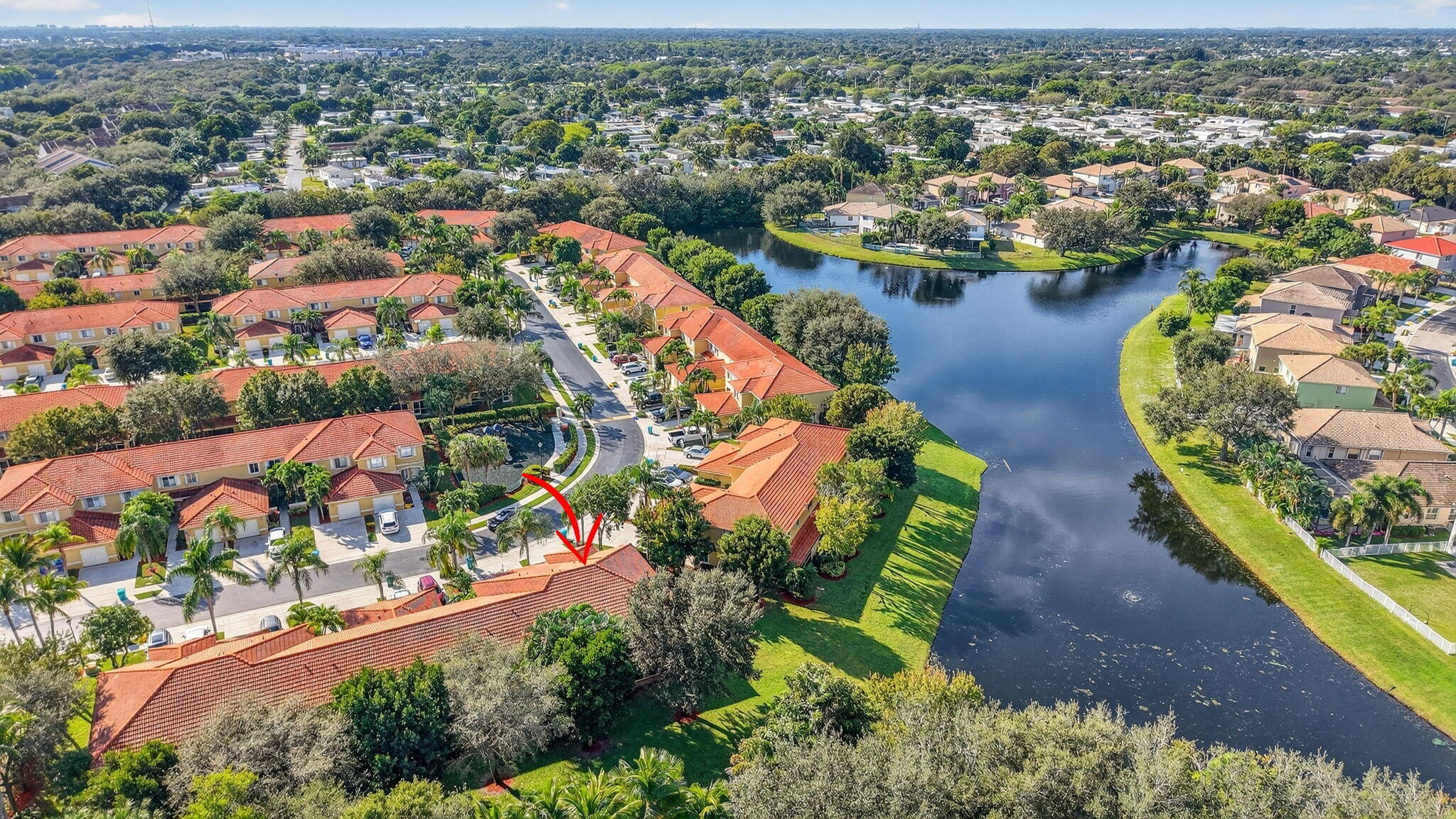 1728 Arezzo Circle Boynton Beach, FL 33436 - Photo 44 of 66 an aerial view of lake and residential houses with outdoor space