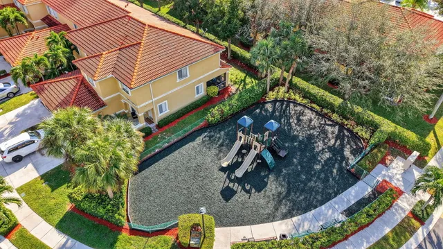 a view of a house with a cars park