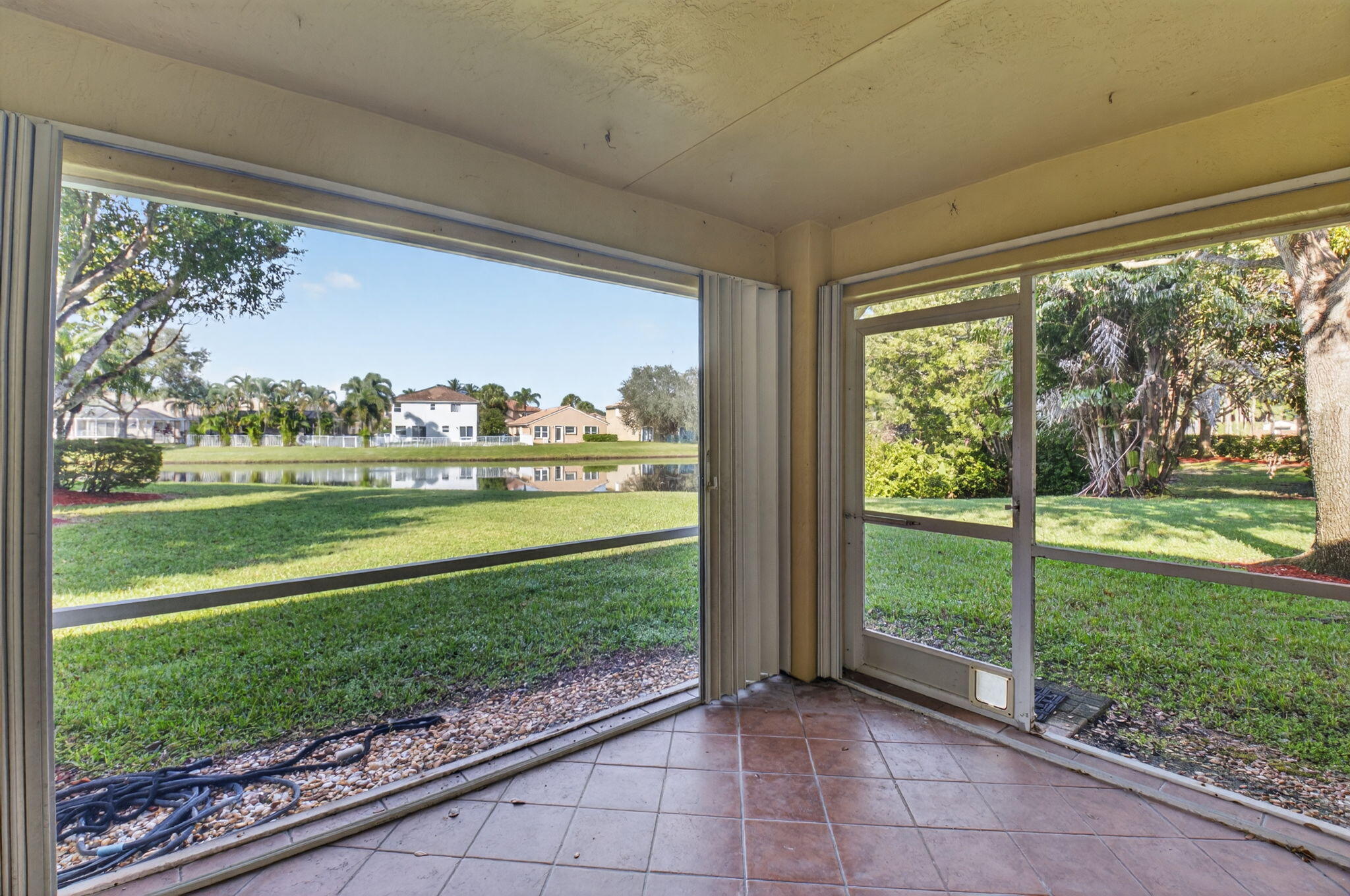 1728 Arezzo Circle Boynton Beach, FL 33436 - Photo 53 of 66 a view of a porch and a yard