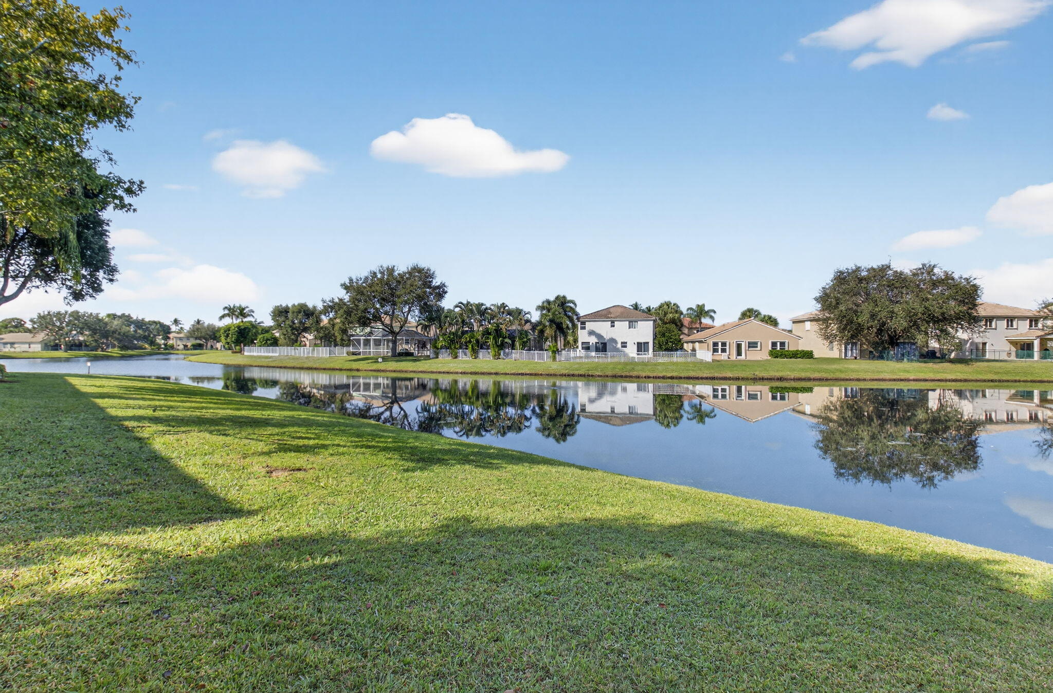 1728 Arezzo Circle Boynton Beach, FL 33436 - Photo 58 of 66 a view of a lake with houses in the back