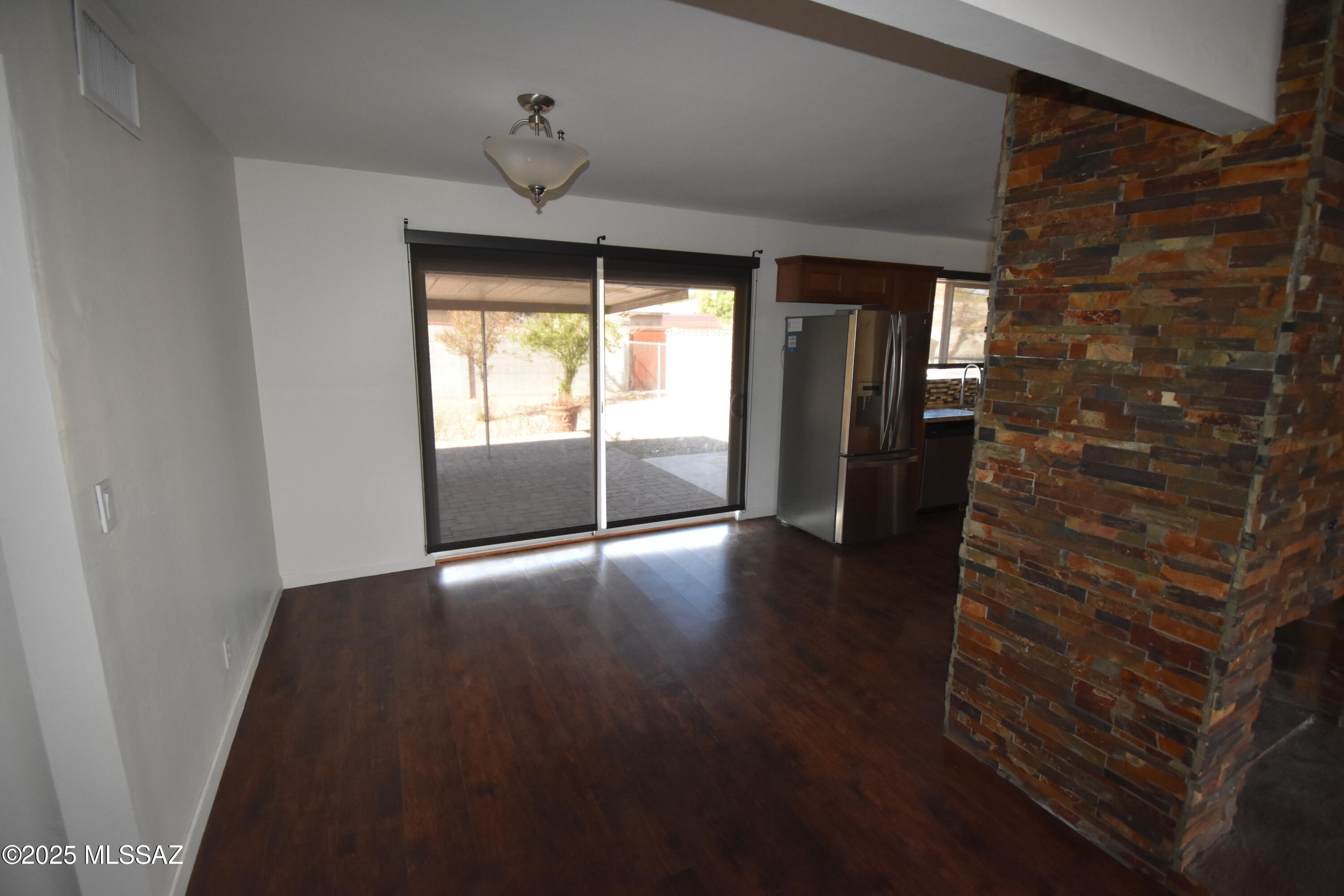 5501 East Spring Street Tucson, AZ 85712 - Photo 15 of 32 a view of empty room with wooden floor and fan