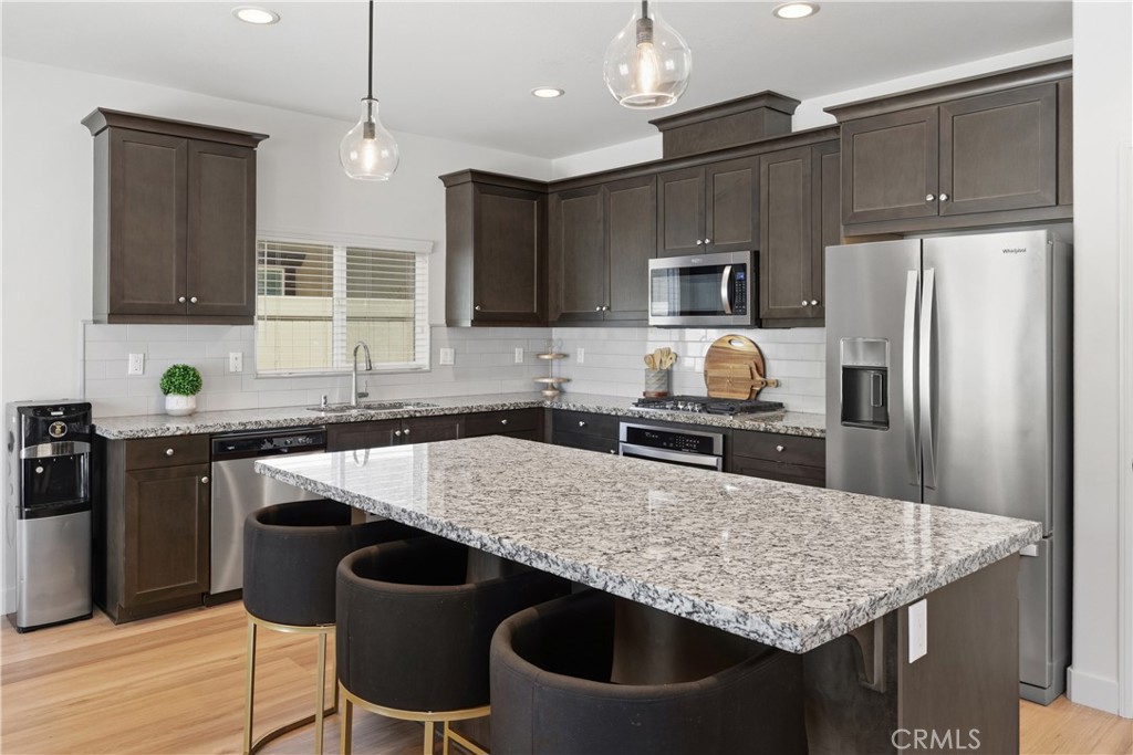 34727 Ribbon Grass Way Murrieta, CA 92563 - Photo 5 of 54 Open-concept gourmet kitchen with island bar seating