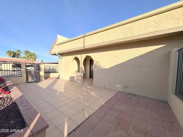 a view of park along with palm trees