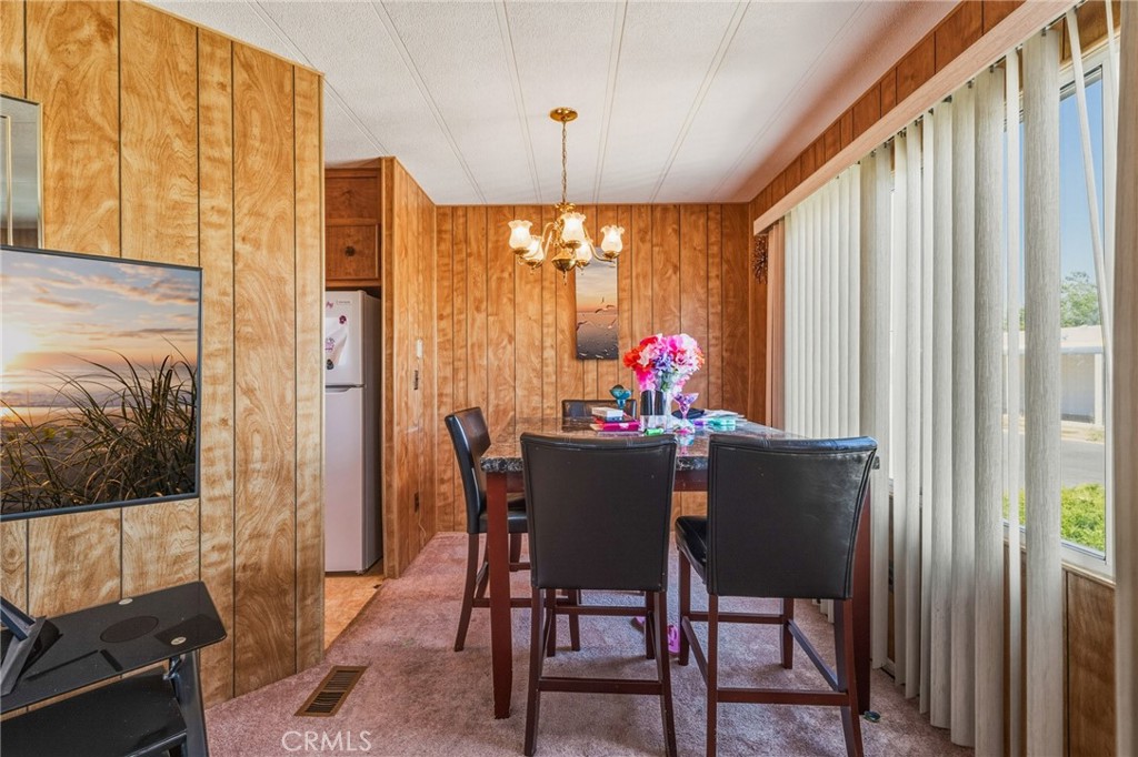 20683 Waalew Road, Unit B201 Apple Valley, CA 92307 - Photo 12 of 32 a view of a dining room with furniture window and outdoor view