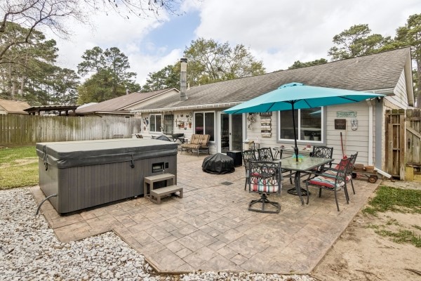 9211 Benwick Street Spring, TX 77379 - Photo 18 of 24 Glass Top Patio table and 6 chairs with Sun Shade stay with the home.