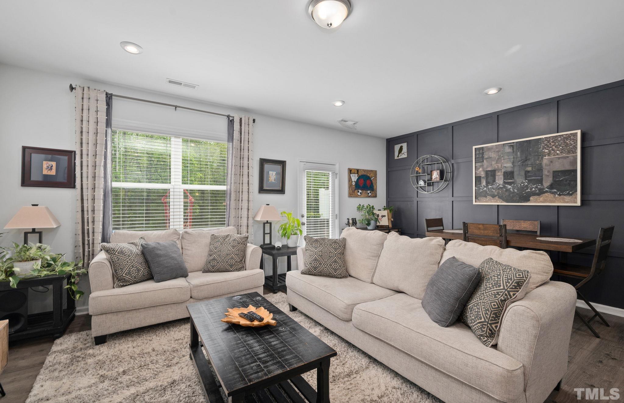 3614 Water Mist Lane Raleigh, NC 27604 - Photo 12 of 50 a living room with furniture and a large window