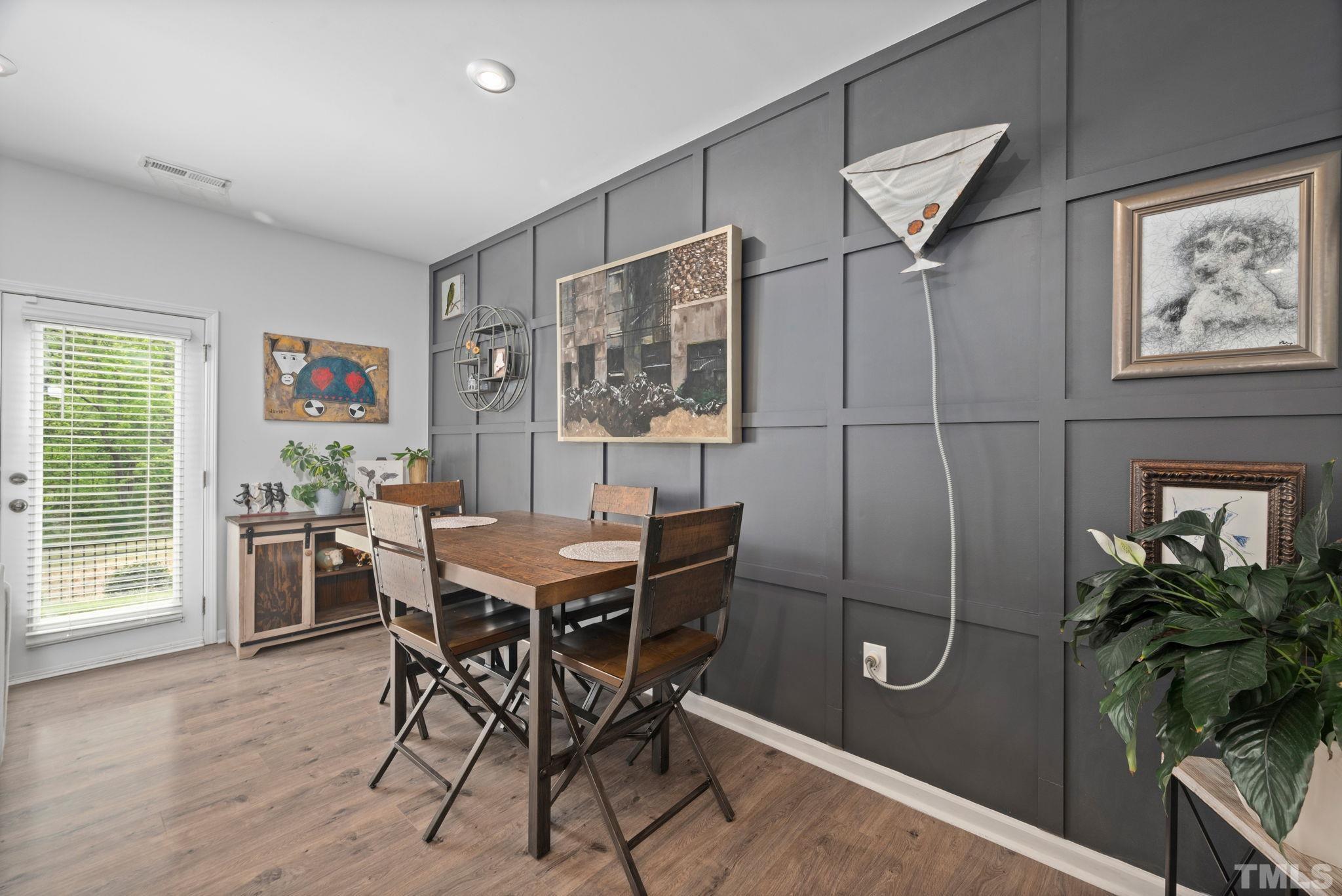 3614 Water Mist Lane Raleigh, NC 27604 - Photo 14 of 50 a view of a dining room with furniture window and wooden floor