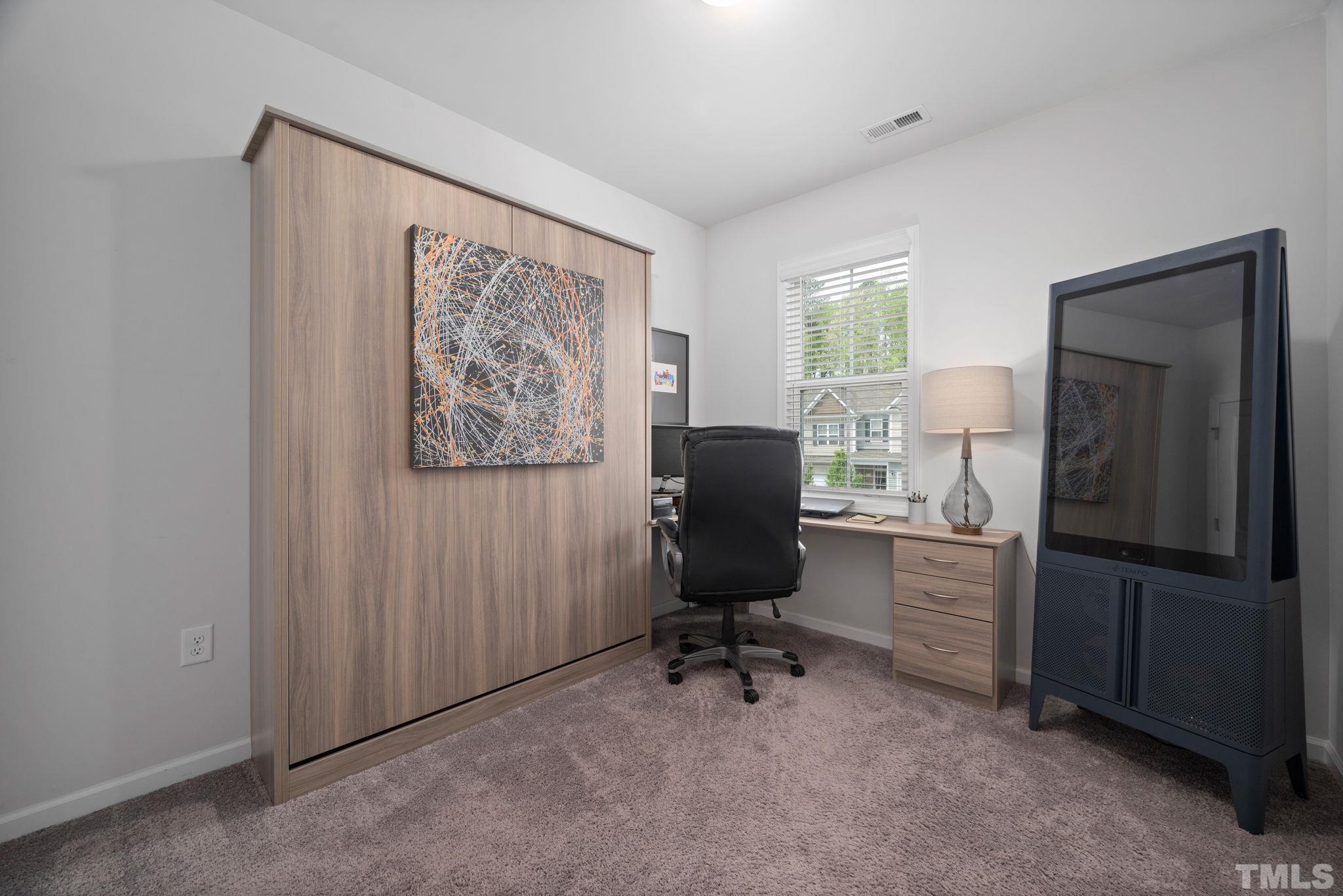 3614 Water Mist Lane Raleigh, NC 27604 - Photo 16 of 50 a view of a workspace with furniture and a window