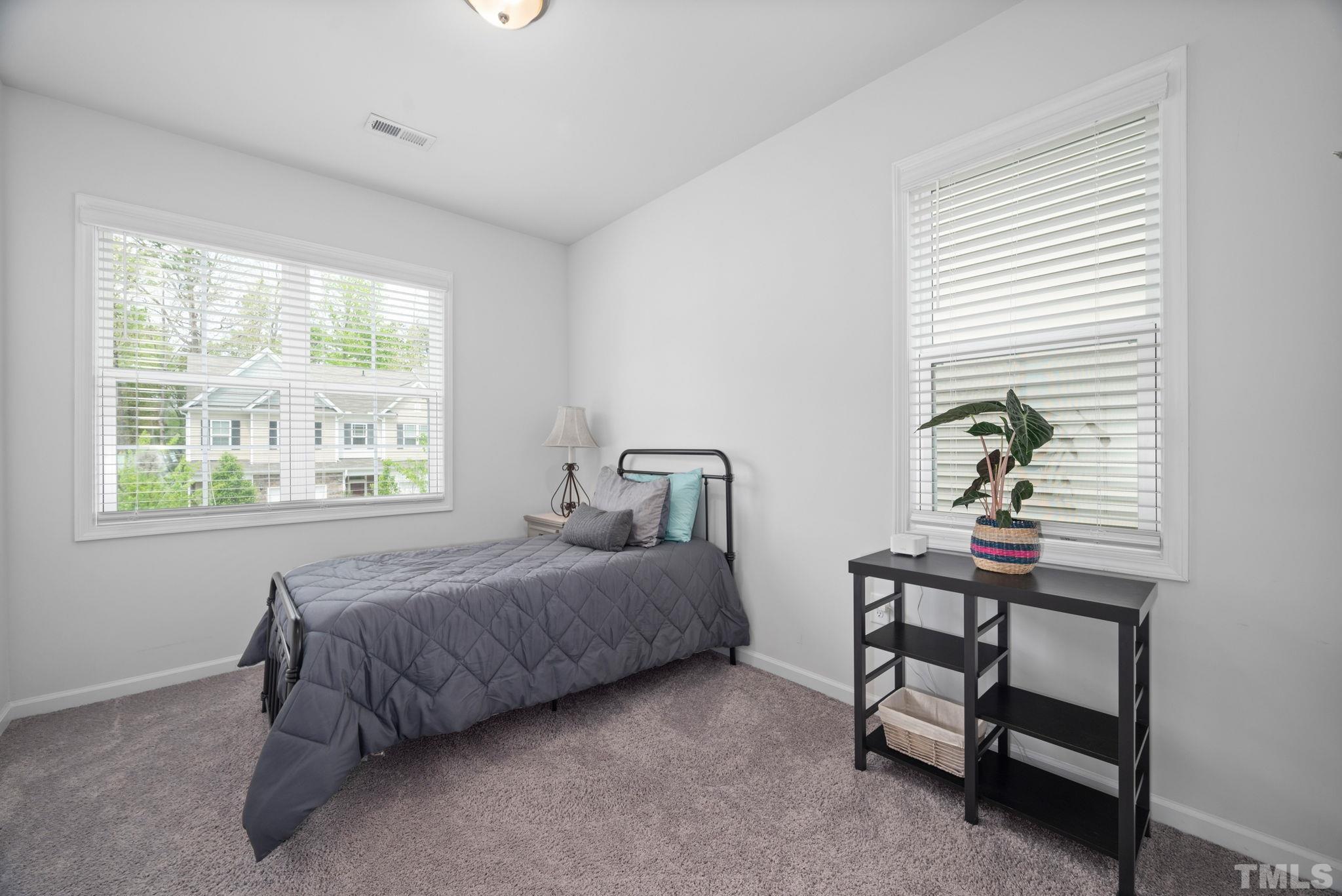 3614 Water Mist Lane Raleigh, NC 27604 - Photo 17 of 50 a bedroom with a bed and a window