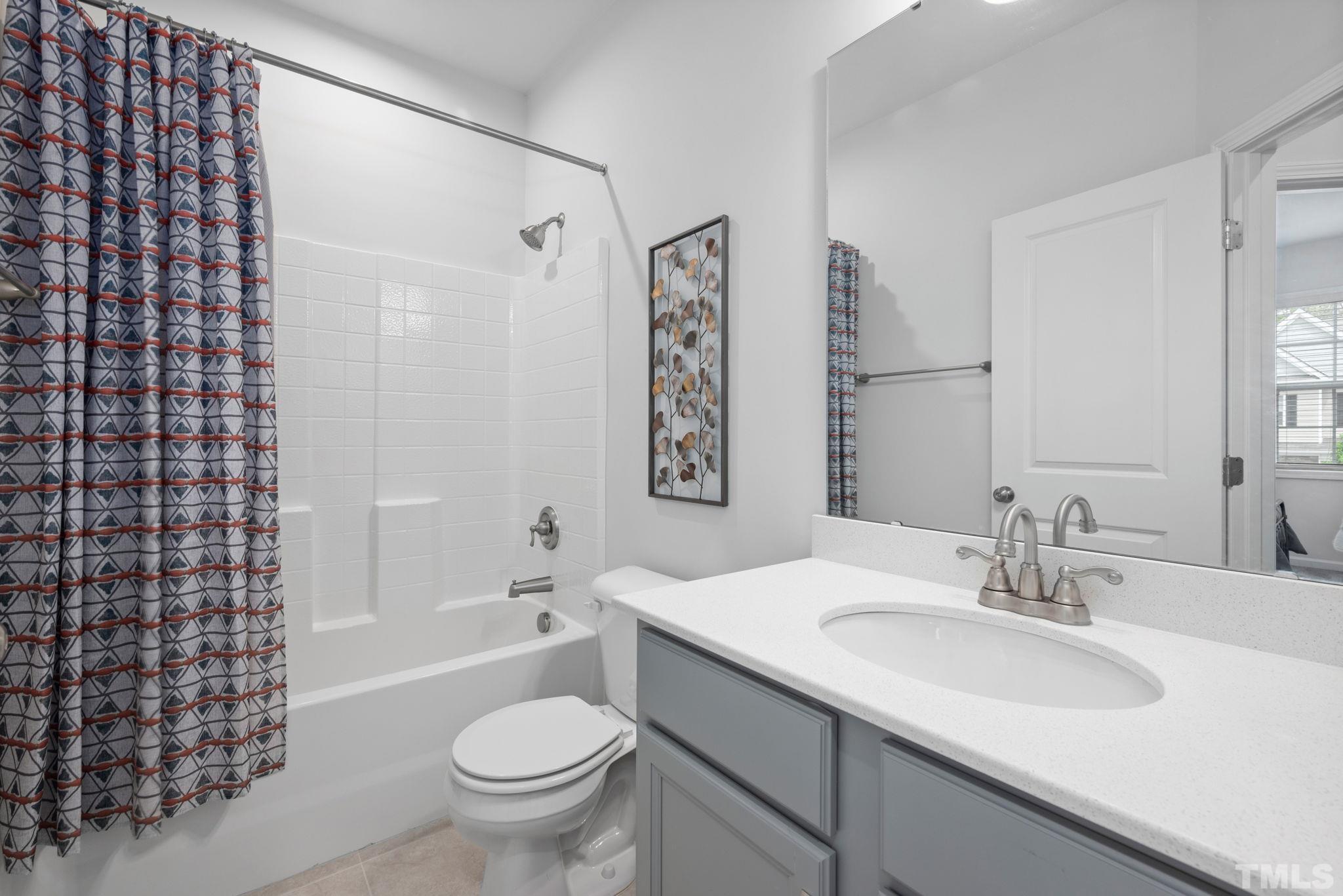 3614 Water Mist Lane Raleigh, NC 27604 - Photo 19 of 50 a bathroom with a sink toilet and shower