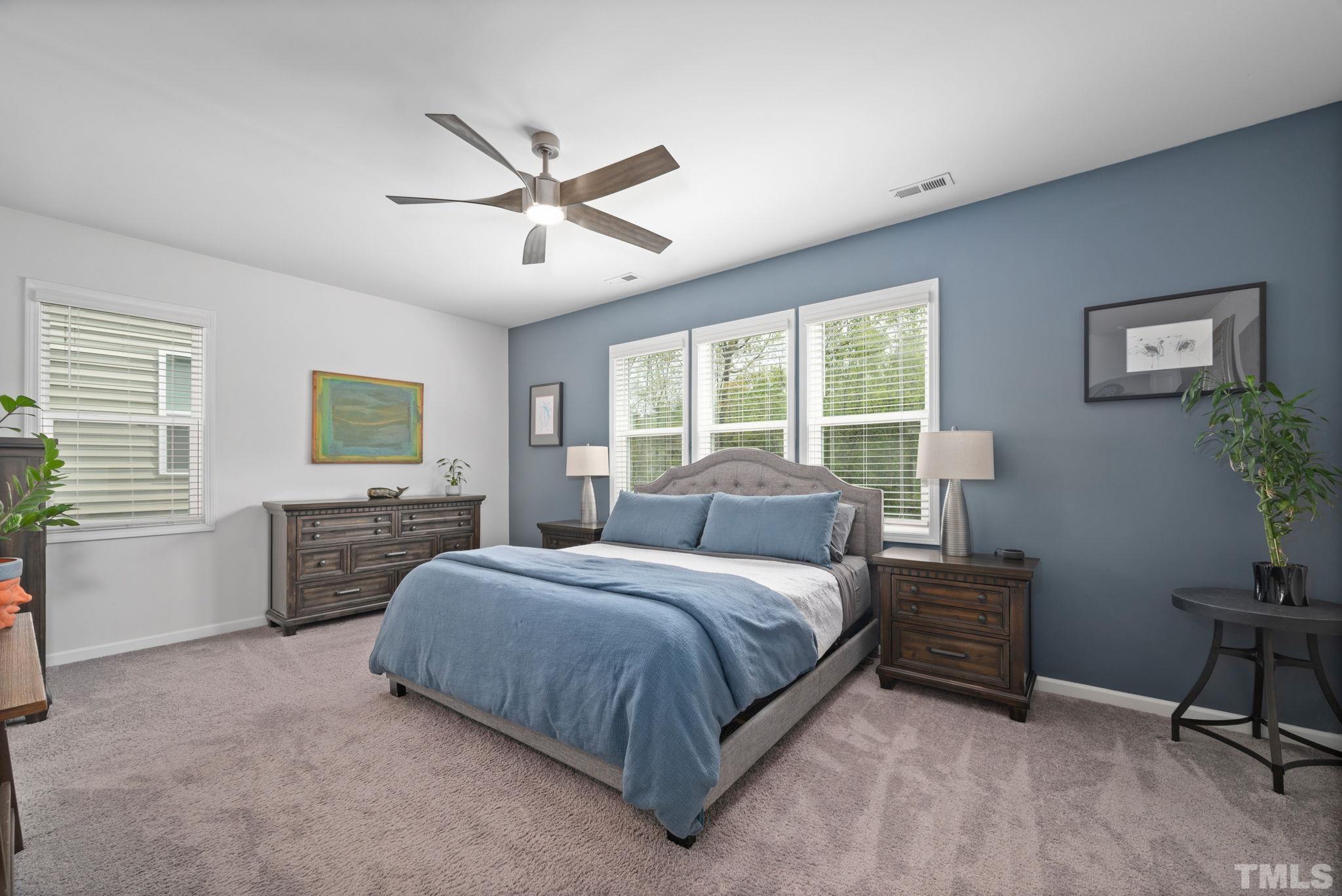 3614 Water Mist Lane Raleigh, NC 27604 - Photo 21 of 50 a bedroom with a large bed and a window