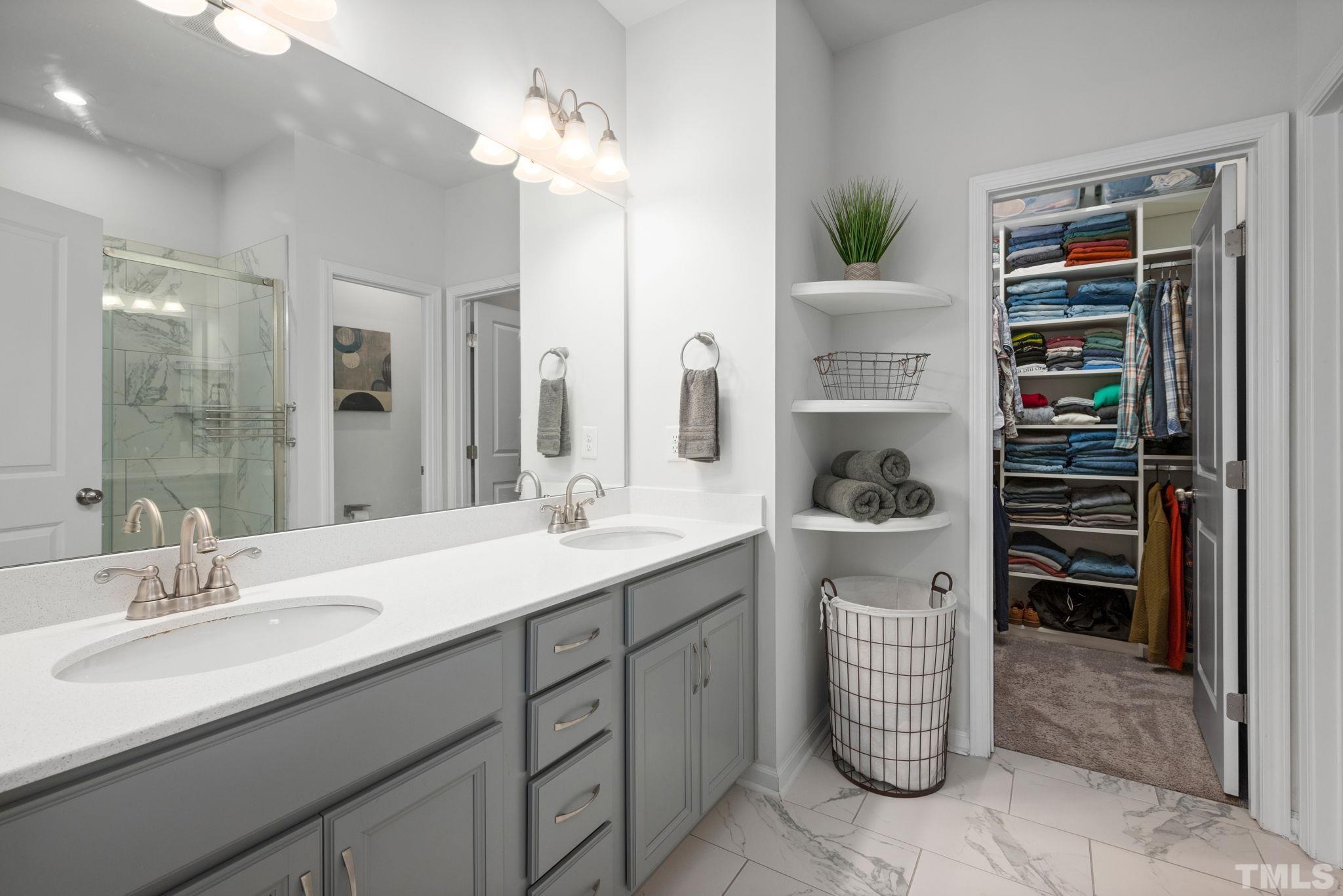 3614 Water Mist Lane Raleigh, NC 27604 - Photo 22 of 50 a en suite bathroom with a double vanity sink a and a mirror