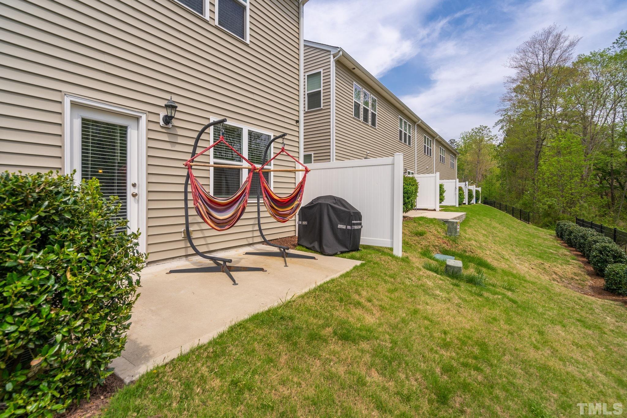 3614 Water Mist Lane Raleigh, NC 27604 - Photo 28 of 50 a backyard of a house with garden and plants