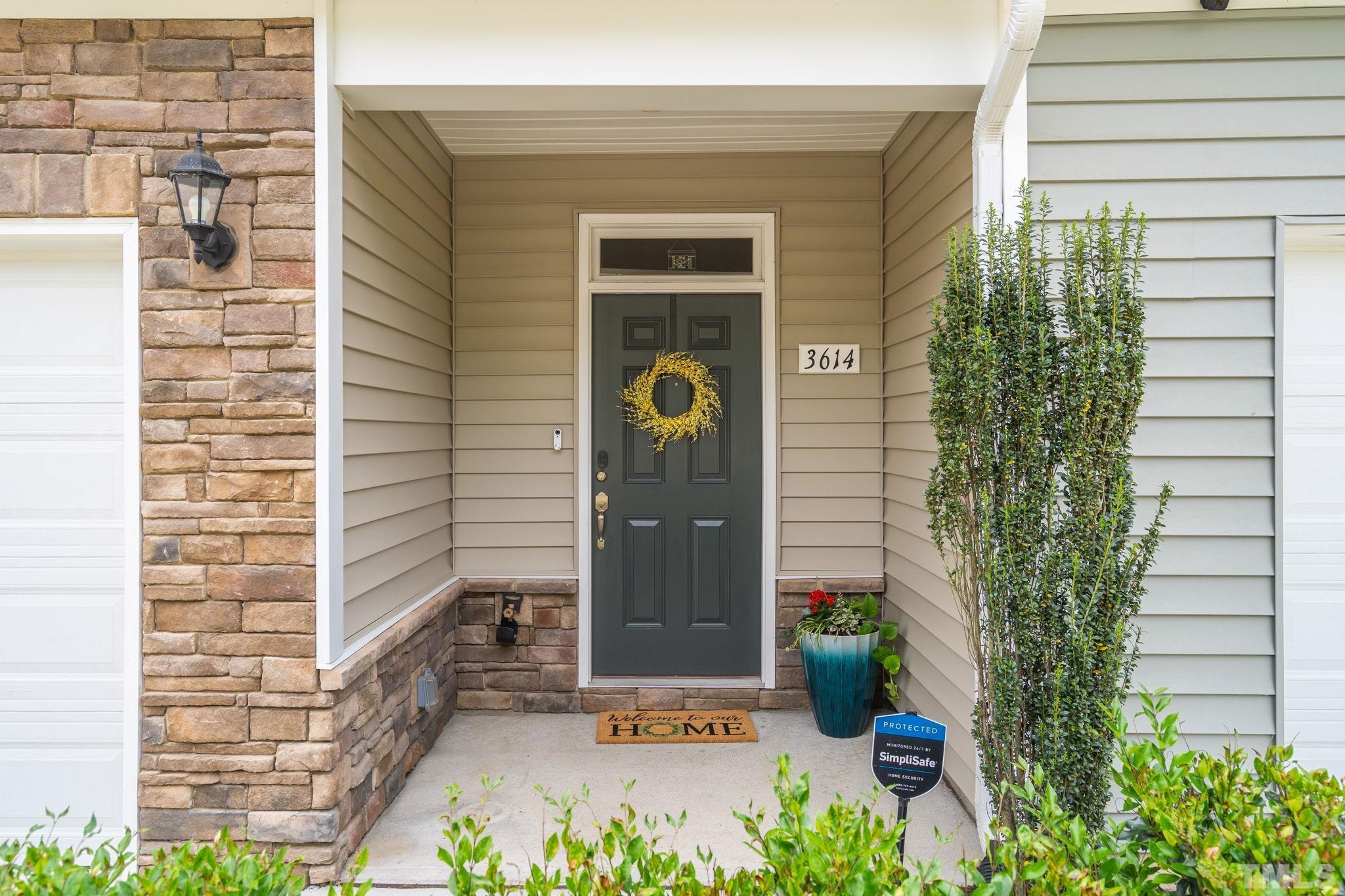 3614 Water Mist Lane Raleigh, NC 27604 - Photo 3 of 50 a front view of a house with garden