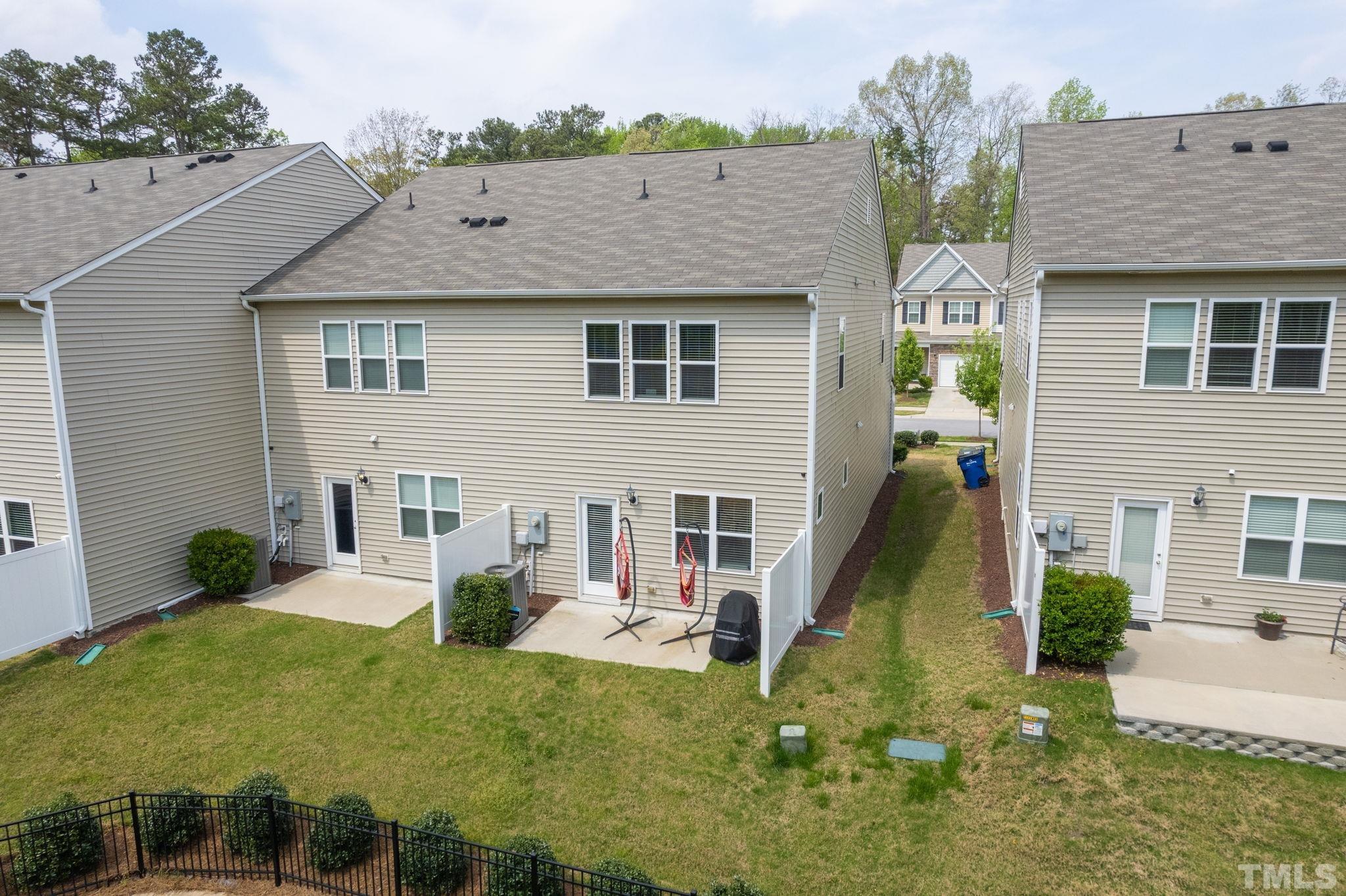 3614 Water Mist Lane Raleigh, NC 27604 - Photo 36 of 50 a view of a house with a yard and potted plants