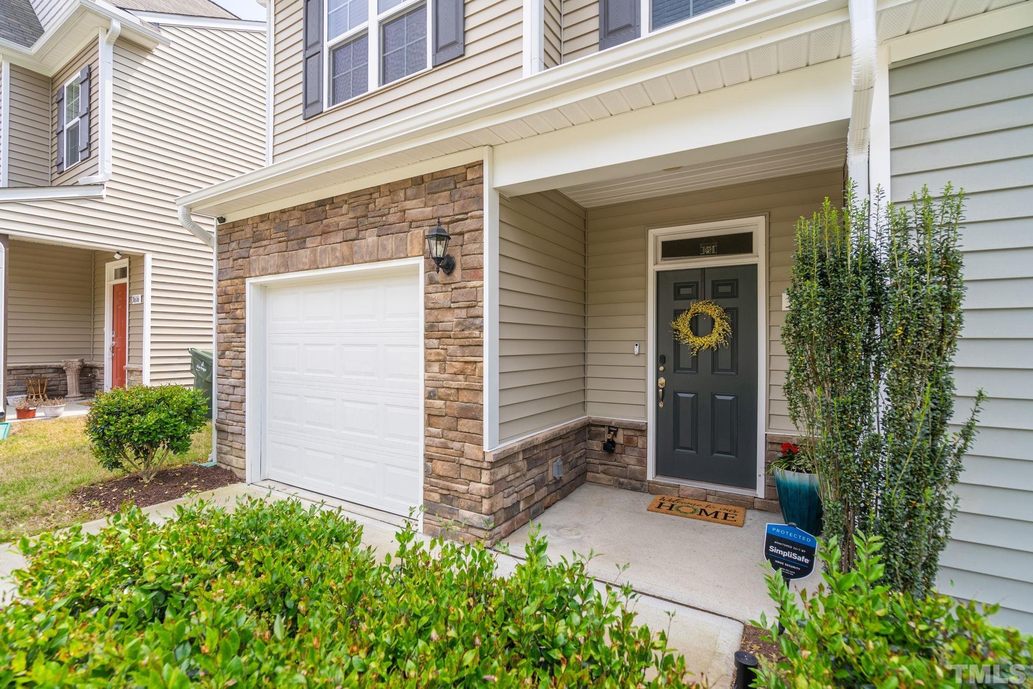3614 Water Mist Lane Raleigh, NC 27604 - Photo 4 of 50 front view of a house with potted plants