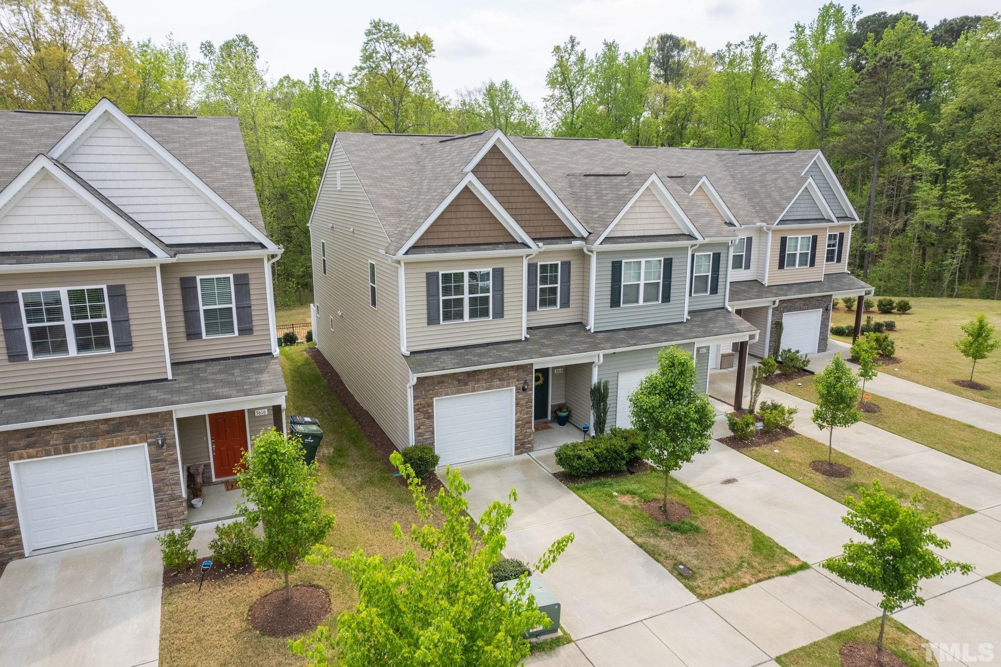 3614 Water Mist Lane Raleigh, NC 27604 - Photo 45 of 50 a aerial view of a house with a yard plants and large tree