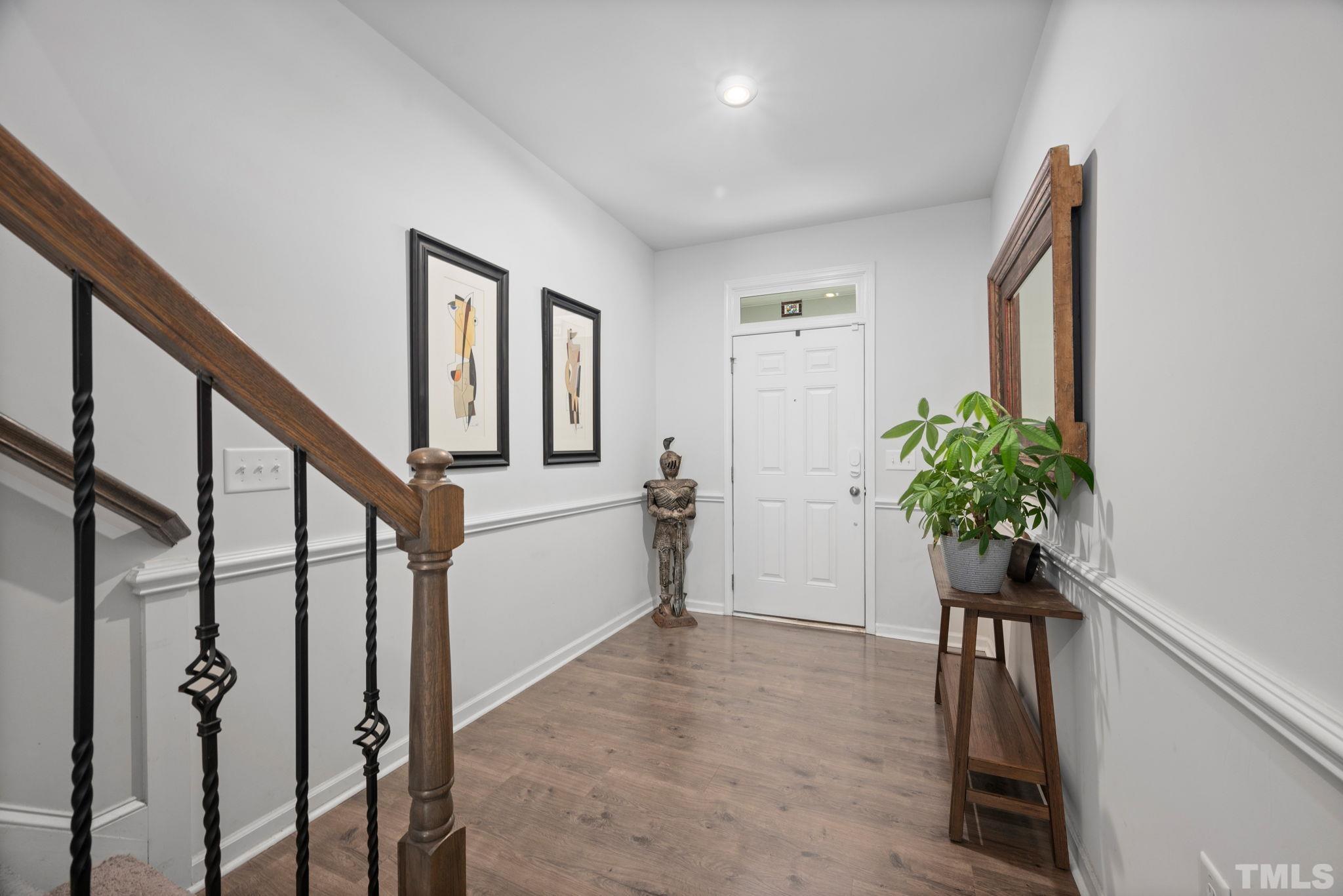 3614 Water Mist Lane Raleigh, NC 27604 - Photo 6 of 50 a view of entryway with wooden floor and stairs