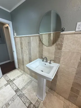 a bathroom with a sink and mirror