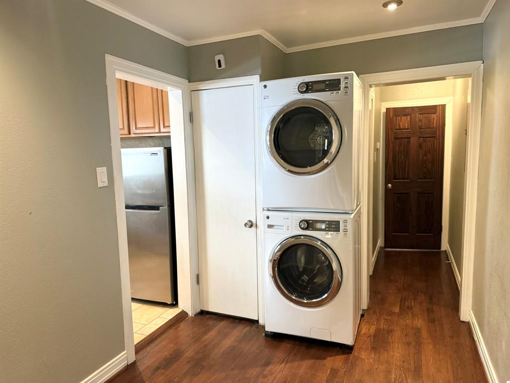4610 Sycamore Street Dallas, TX 75204 - Photo 13 of 14 a utility room with wooden floor washer and dryer