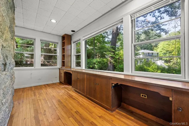 a view of a room with a large window