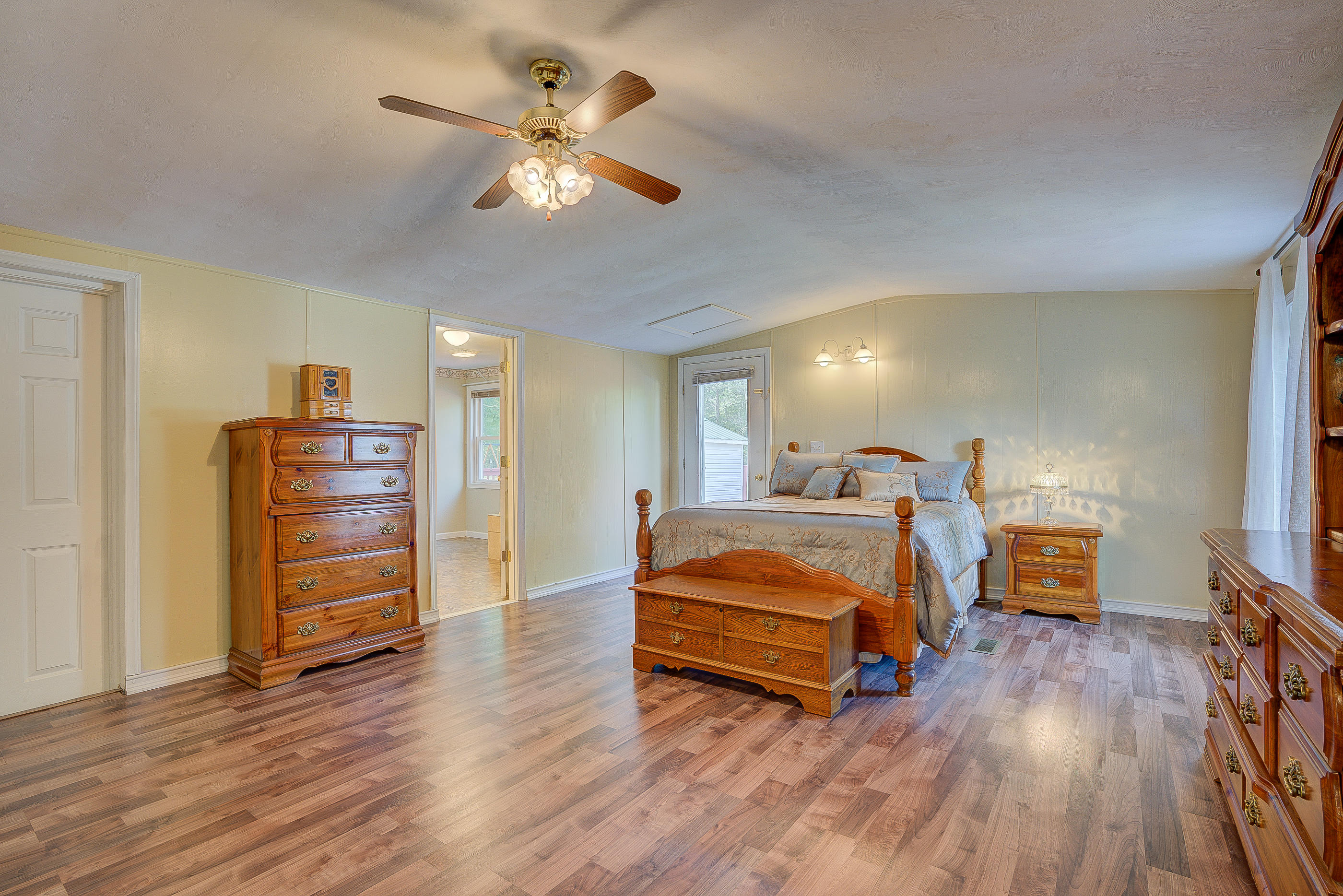 1133 Running Deer Ridge, Unit 1083 Goodview, VA 24095 - Photo 11 of 35 a bedroom with furniture and a chandelier