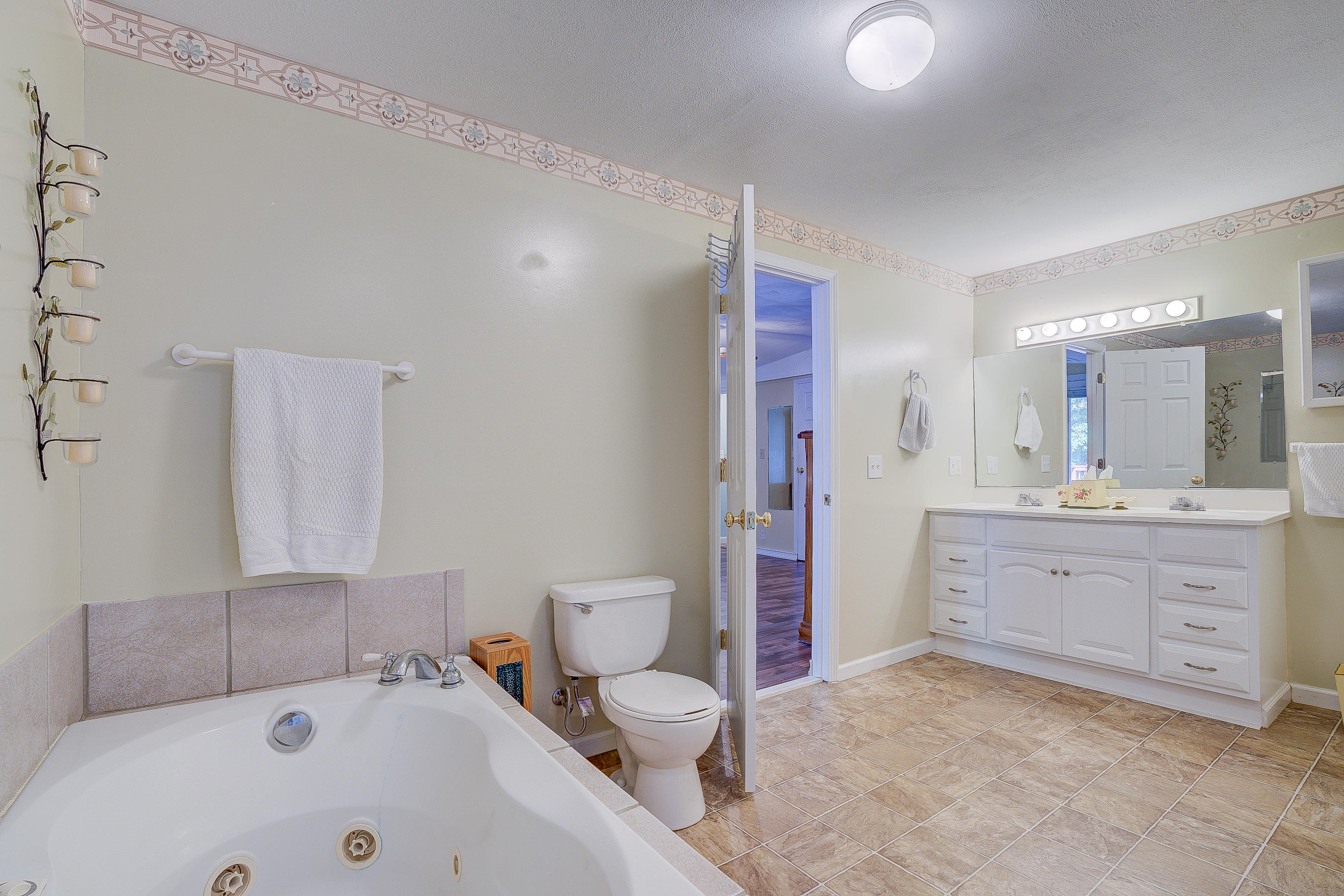 1133 Running Deer Ridge, Unit 1083 Goodview, VA 24095 - Photo 12 of 35 a bathroom with a sink toilet tub and shower