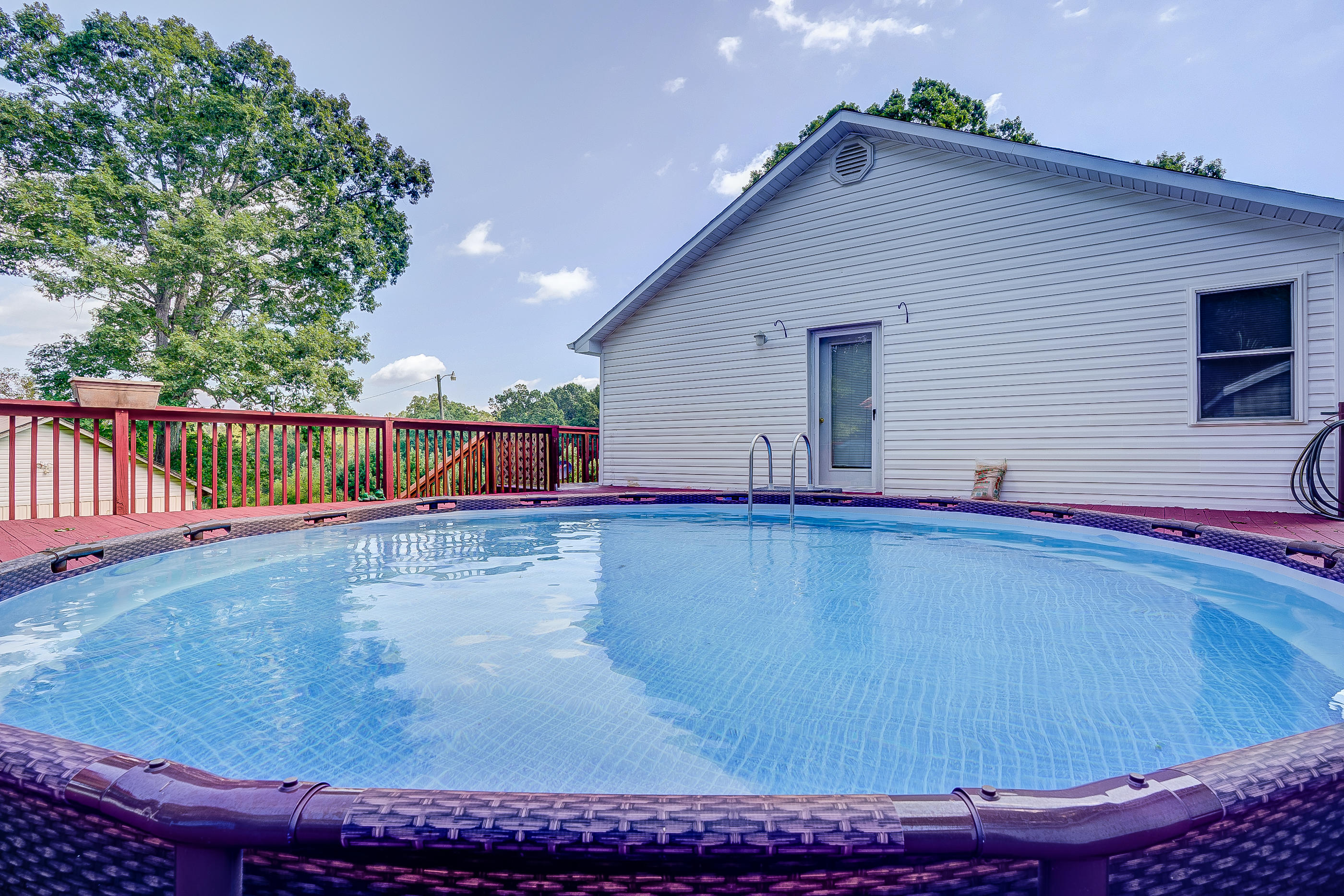 1133 Running Deer Ridge, Unit 1083 Goodview, VA 24095 - Photo 14 of 35 a view of a house with backyard and sitting area