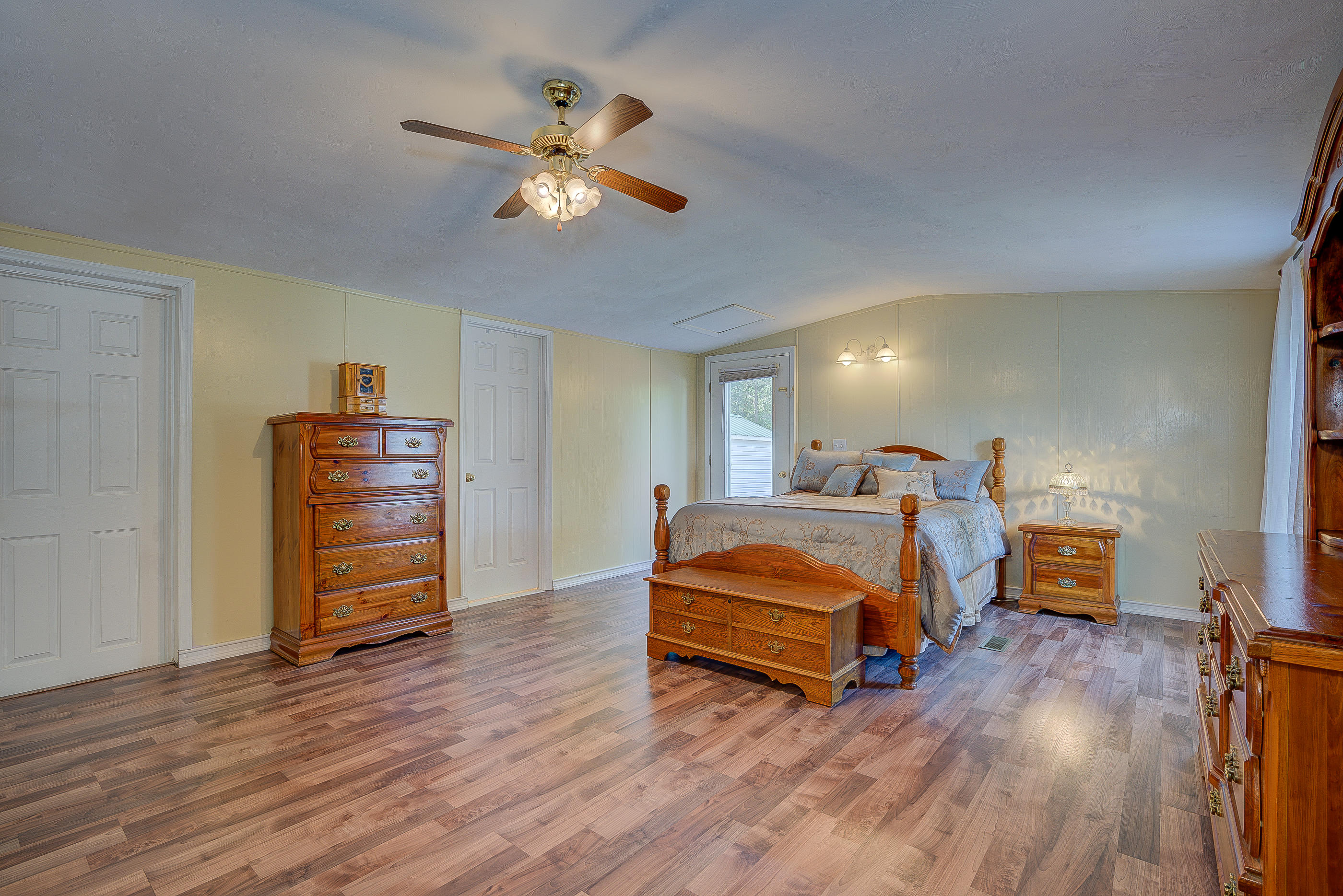 1133 Running Deer Ridge, Unit 1083 Goodview, VA 24095 - Photo 15 of 35 a bedroom with bed and wooden floor