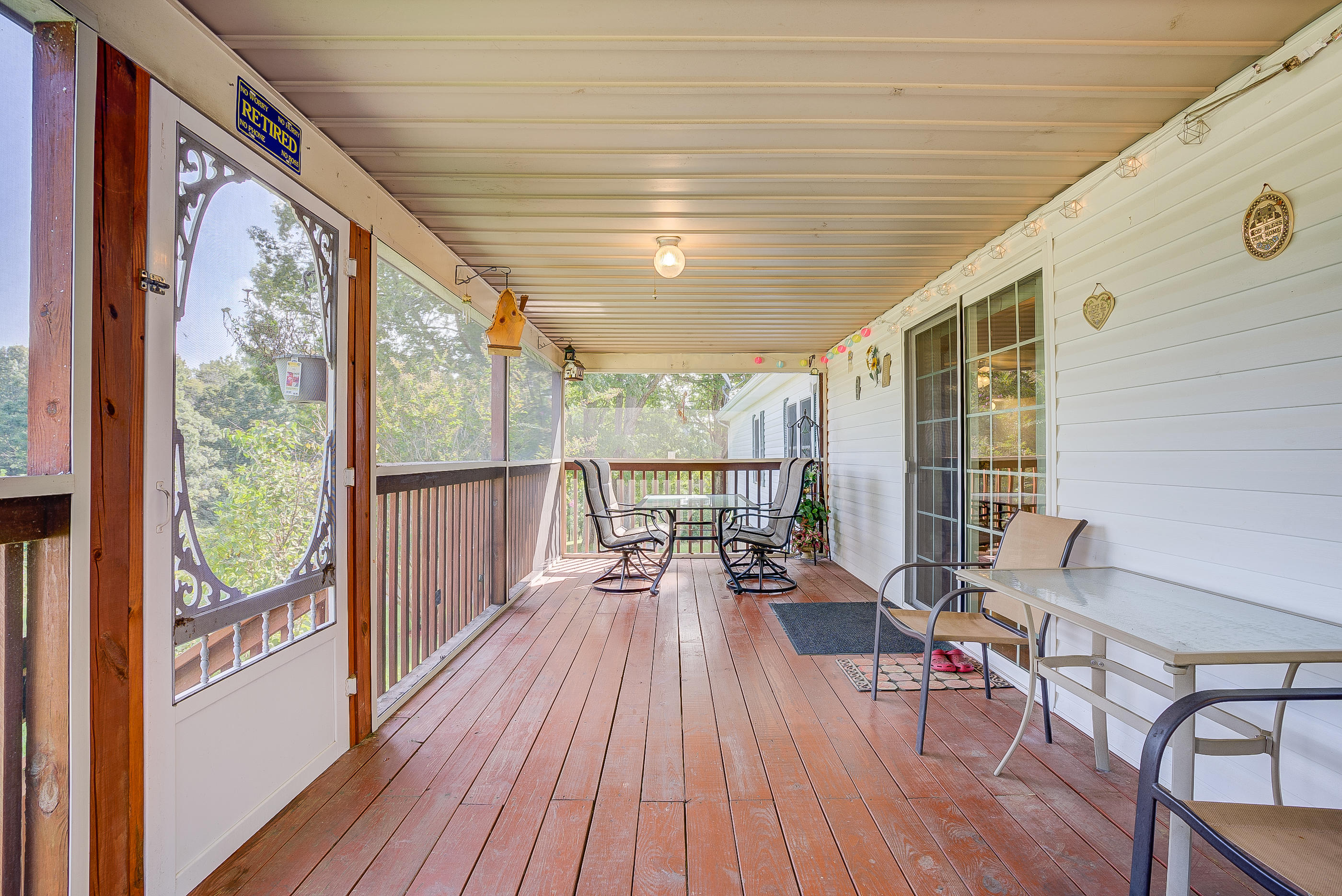 1133 Running Deer Ridge, Unit 1083 Goodview, VA 24095 - Photo 17 of 35 a living room with hardwood floor and large windows