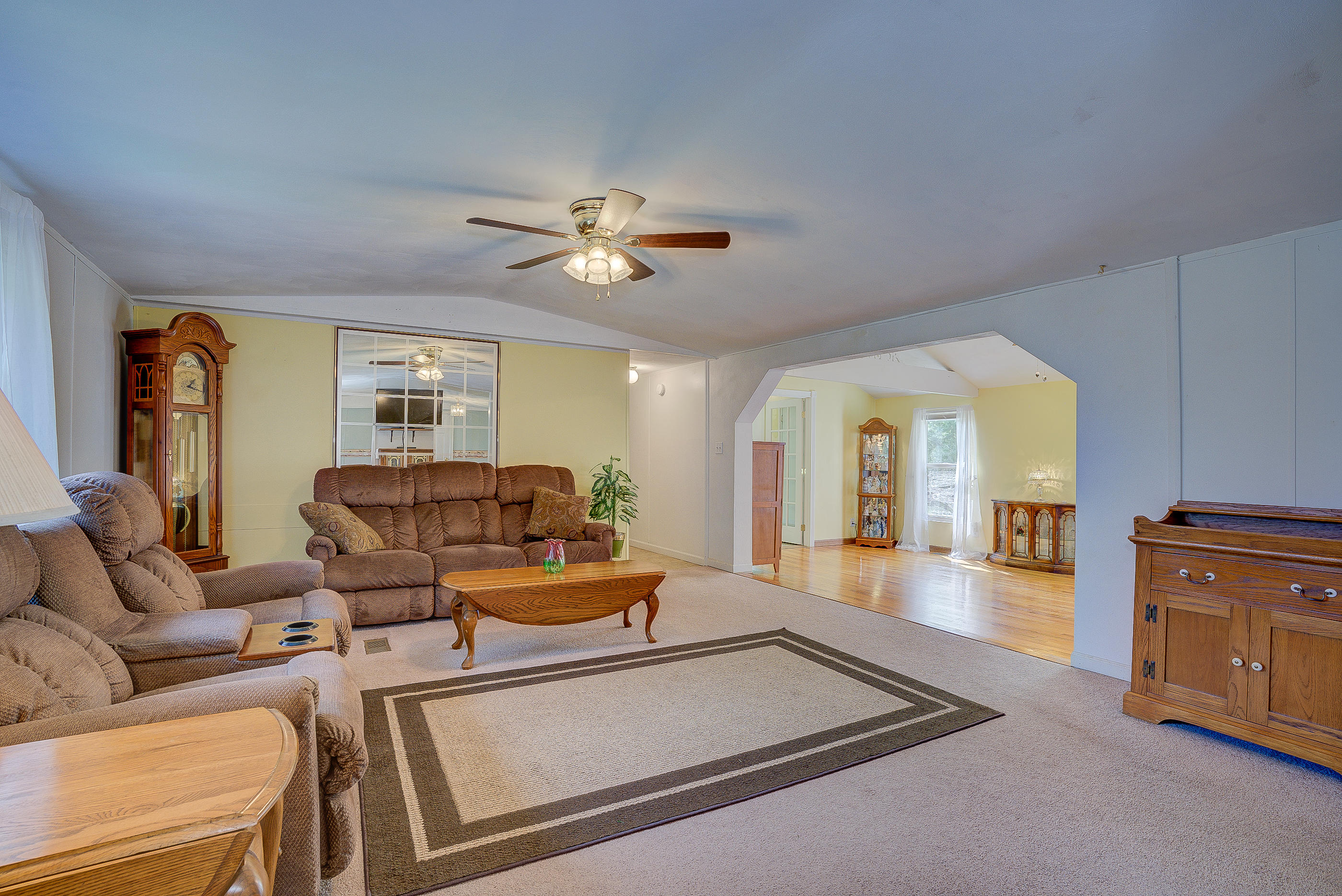 1133 Running Deer Ridge, Unit 1083 Goodview, VA 24095 - Photo 20 of 35 a living room with furniture and a chandelier